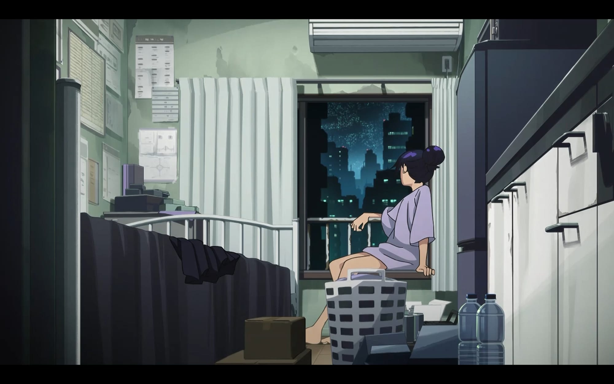 nyaan looks out the window of her cramped apartment