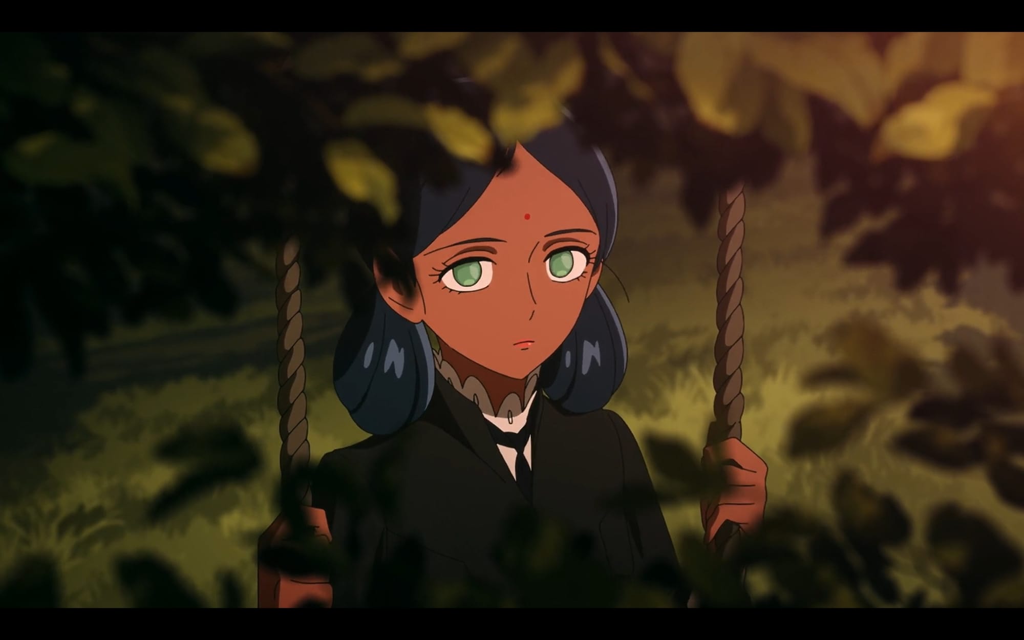 lalah can be seen through a frame of leaves, on a swing