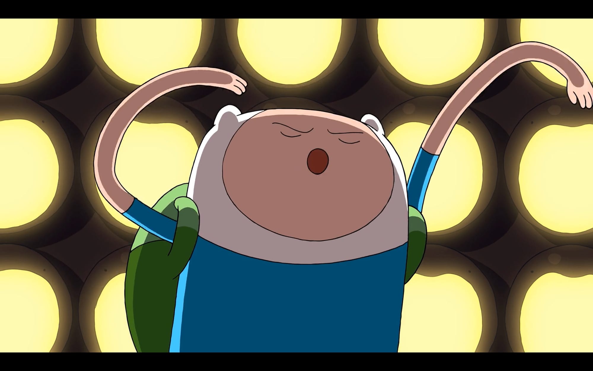 Finn is singing with his back to the door. The door's many glowing mouths open wide.
