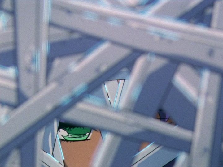 anthy, a woman with brown skin and green eyes, looks out from a small crack in a wall of swords