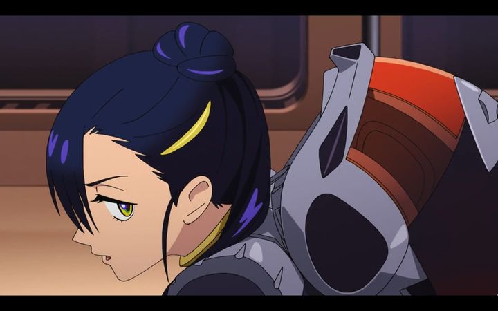 nyaan wearing her spacesuit looks out towards the audience from the corner of her eye