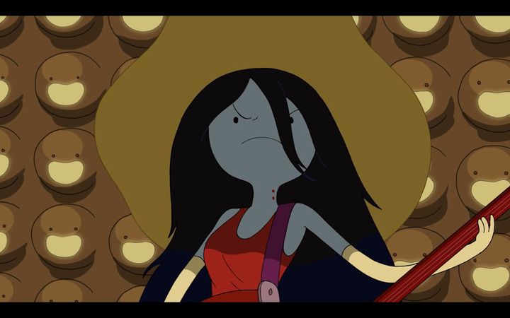 Marceline the Vampire Queen, a vampire teenage girl wearing a big hat, scowls while she plays her bass. Red bite scars can be seen on her neck.
