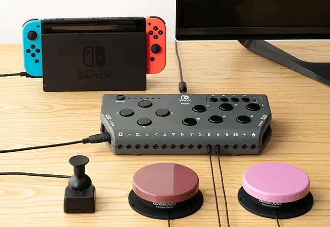An image of the Hori Flex Controller with two buttons and a joystick plugged in.