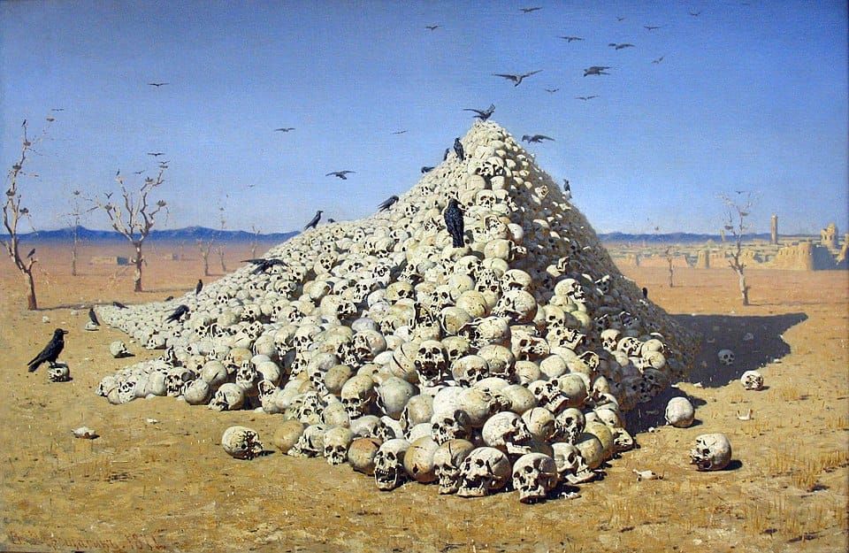 A towering pile of skulls, picked clean of flesh by scavanging birds, surrounded by dead trees and grass with a city of ruins in the background.