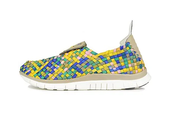 Nike Free Woven Khaki Stadium Green Hyper Blue Pink outsole flex groove detail.