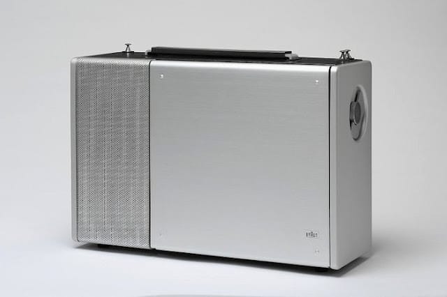 Braun T1000 CD World Receiver (1962/63) designed by Dieter Rams — multi-band shortwave radio with hinged clear lid, aluminium front panel, black rotary knobs and red accent switch on white housing