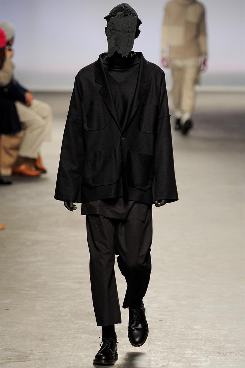 Craig Green FW2013 MAN look 8 — white vinyl-edged jacket with matte cotton trousers and deconstructed wood plank crown