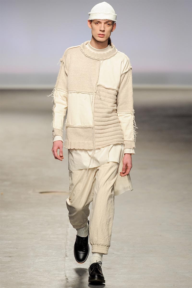 Craig Green FW2013 MAN look 9 — dichromatic black-and-white layered ensemble with oversized silhouette and timber headpiece