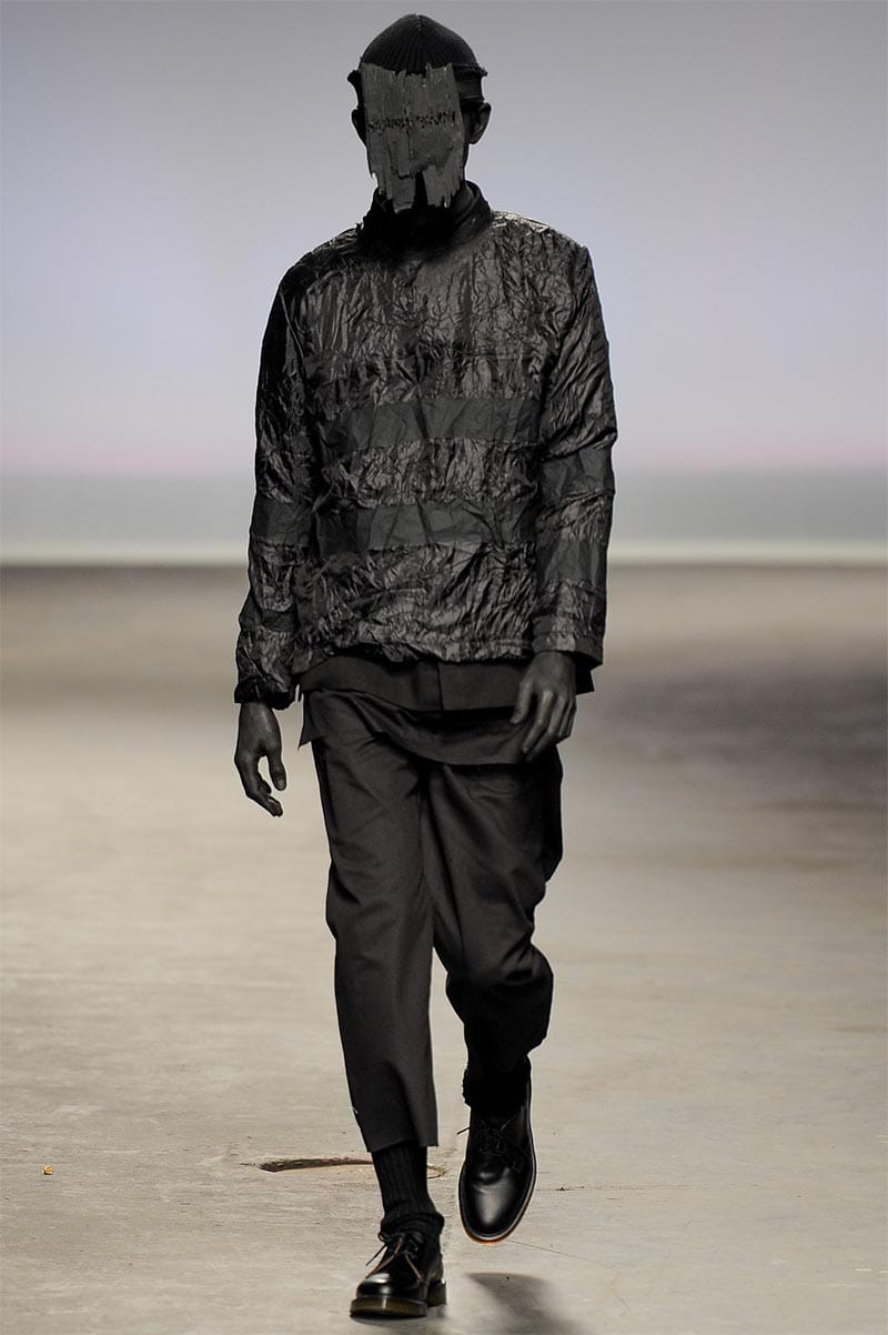 Craig Green FW2013 MAN look 12 — black padded and layered separates with hand-painted stripe detail and wooden crown