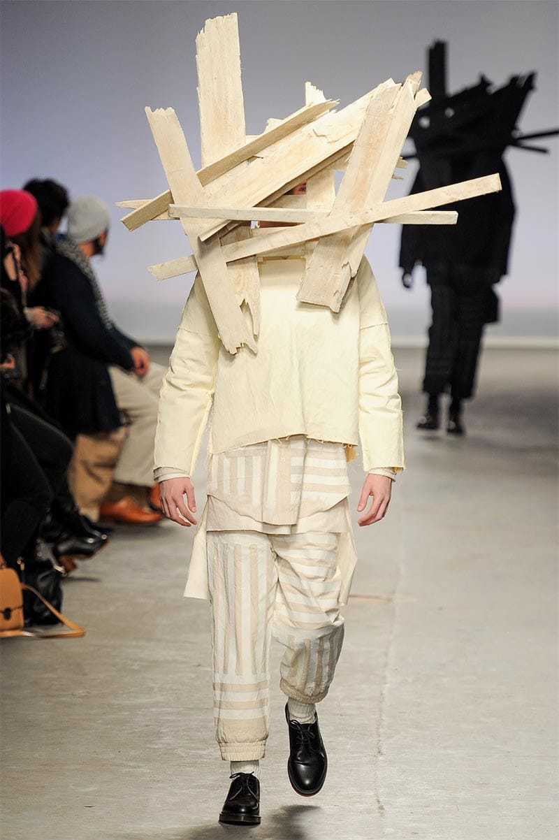 Craig Green FW2013 MAN look 15 — white and black mixed-texture coat with felt and cotton layers over rolled-hem trousers