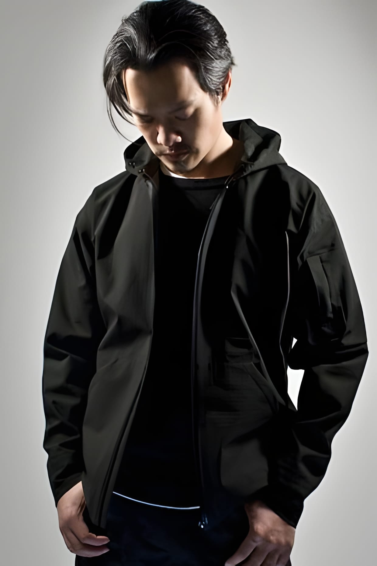 ACRONYM 2009 Fall/Winter black hooded zip jacket worn, front view.