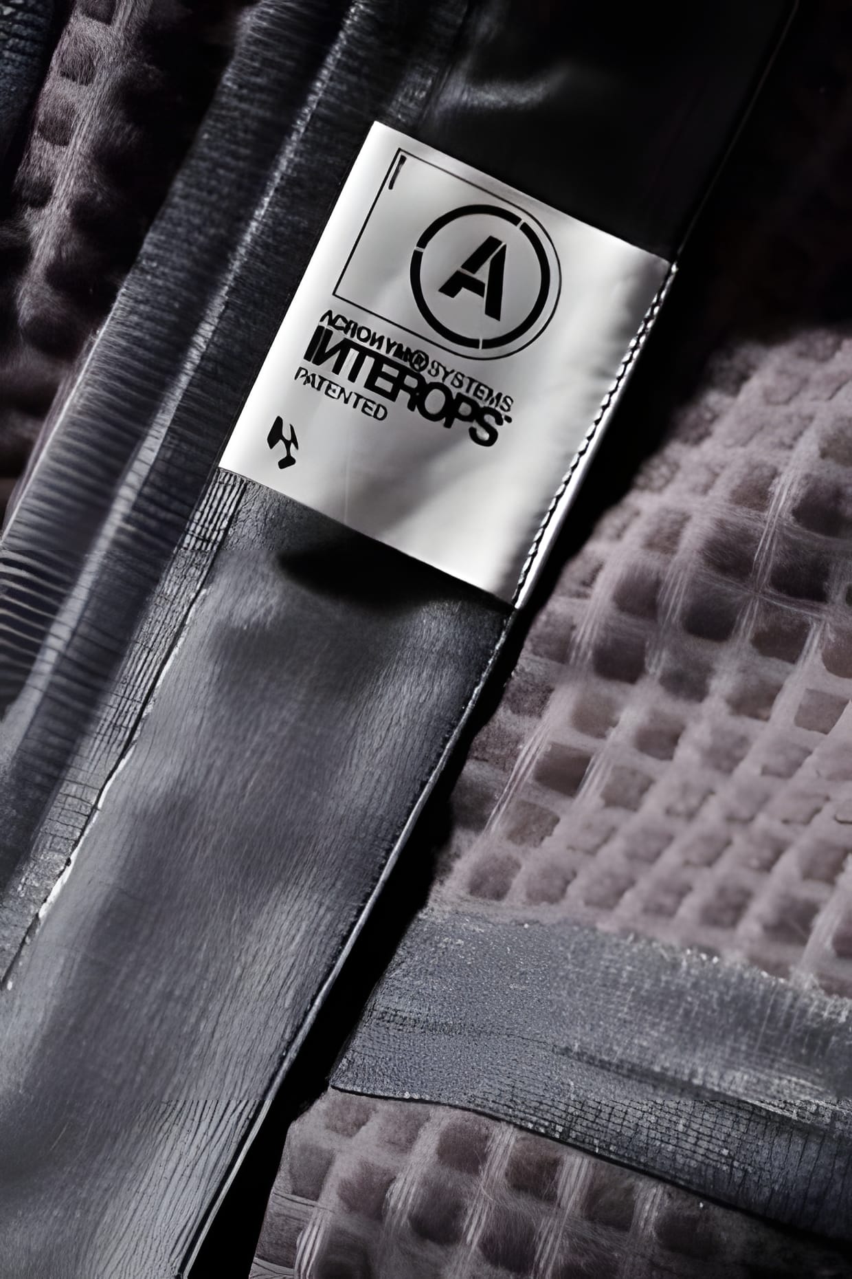 ACRONYM woven 'A' label on waffle-knit lining — 2009 Fall/Winter detail.