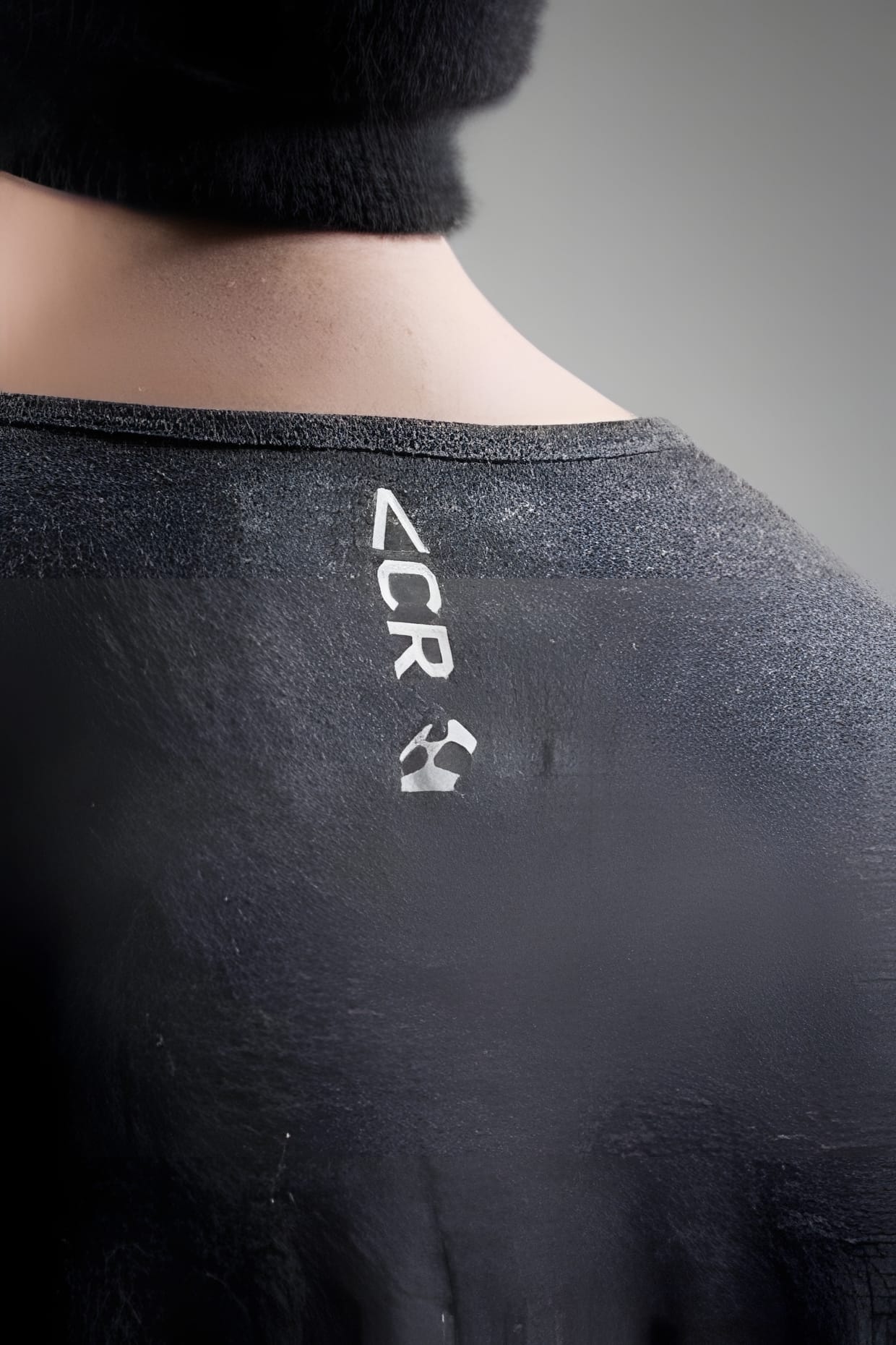 ACRONYM 2009 Fall/Winter — back collar logo and recycle mark detail.