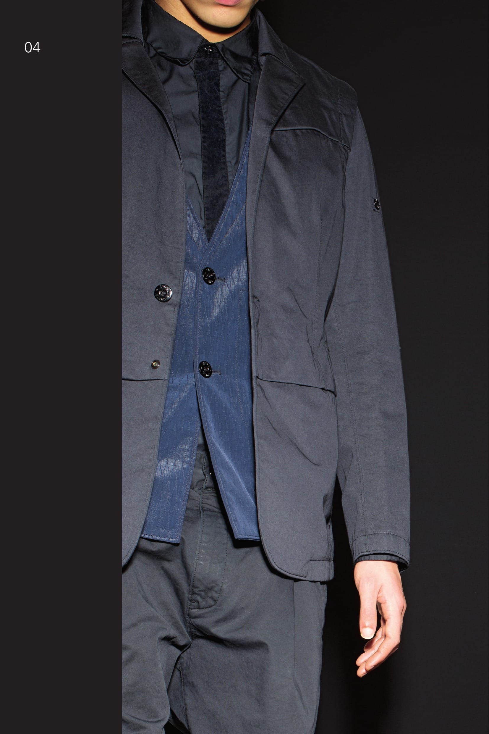 A0203 CATEGORY_RESIST COMPONENT BLAZER_RASO-R 3L_DIAMOND-R 3L Pure design and functionality innovation for this formal look blazer consisting in an outer waistcoat in Satin-R 3L and an inner jacket in Diamond-R 3L, finely ribbed stretch panels and Satin-R 3L sleeves. RASO-R 3L WITH WINDSTOPPER® RASO-R, developed in association with W.L. Gore and Associates exclusively for STONE ISLAND SHADOW, in many ways represents the creation and ultimate expression of the SHADOW PROJECT concept. Taking one of the historic Stone Island fabrics – Raso Gommato as a starting point, the classic STONE ISLAND look is combined with one of the most advanced performance technologies on the market today. The Windstopper® membrane provides exceptional and unbeatable balance in terms of protection and comfort. STONE ISLAND garment dyeing expertise generates unique colours that cannot be found in any other performance fabric. DIAMOND-R 3L With its unique composite construction, Diamond-R unabashedly pushes the aesthetic envelope of performance fabrics. Its performance Wind-Tex® membrane is sandwiched between a soft, haptic outer layer of Lycra® and an inner layer of trilobate ripstop nylon jacquard. The bonding process causes the 3-dimensional diamond pattern of the backer to ‘push though’ the surface of the Lycra®. The result is a 3D 3L shell that both protects and conforms to the body in a new and beautiful way. Developed exclusively for STONE ISLAND SHADOW PROJECT. _ Optimal weather protection: Waterproof and windproof _ Breathable: Allows moisture vapour to escape _ 3-layer construction _ 3-dimensional exterior surface _ Iridescent interior surface _ STONE ISLAND garment dyed Outer waistcoat: Two horizontal pockets partly hidden by a fabric lapel and one small pocket. Small horizon- tal chest pocket partially hidden by lapel. Collar edged with finely ribbed jersey. Button and hidden snap fastening. Inner jacket: Front in Diamond-R 3L with finely ribbed stretch jersey inserts. Two horizontal pockets on the front. Collar and sleeves in RASO-R 3L, with three- button fastening on the sleeves. Back in finely ribbed stretch jersey with Diamond-R 3L inserts. Two-button fastening. 10110 CATEGORY_SKIN_PLACKET SHIRT_NYCO SATIN Shirt in satin weave cotton / nylon. Small CATCH pocket on chest with small vertical opening. Adjust- able cuffs with button fastening partially hidden by placket. Flocking on the placket, which hides the button fastening. Slightly rounded bottom hem. Garment dyed. 30202 CATEGORY_RESIST_PLEATED PANT _RC1 BATAVIA-T Trousers in performance cotton Batavia. Developed exclusively for STONE ISLAND SHADOW PROJECT this RC1 (Resist Cotton 1-ply) high-density gabardine has been impregnated with Teflon® Fabric Protector during the garment dye process. Haptically cool and precise, the subtle matte-sheen belies the 100% cotton composition of the fabric. _ Single layer construction _ Matte-sheen surface _ Water and stain repellency for ideal wearability _ STONE ISLAND garment dyed Trousers with single dart and diagonal pockets on the front. Two back pockets with flap and button fasten- ing. Shaped knee. Panel in finely ribbed stretch jersey embraces the entire calf. Shaped loops at the waist. Zip and button fly closure.