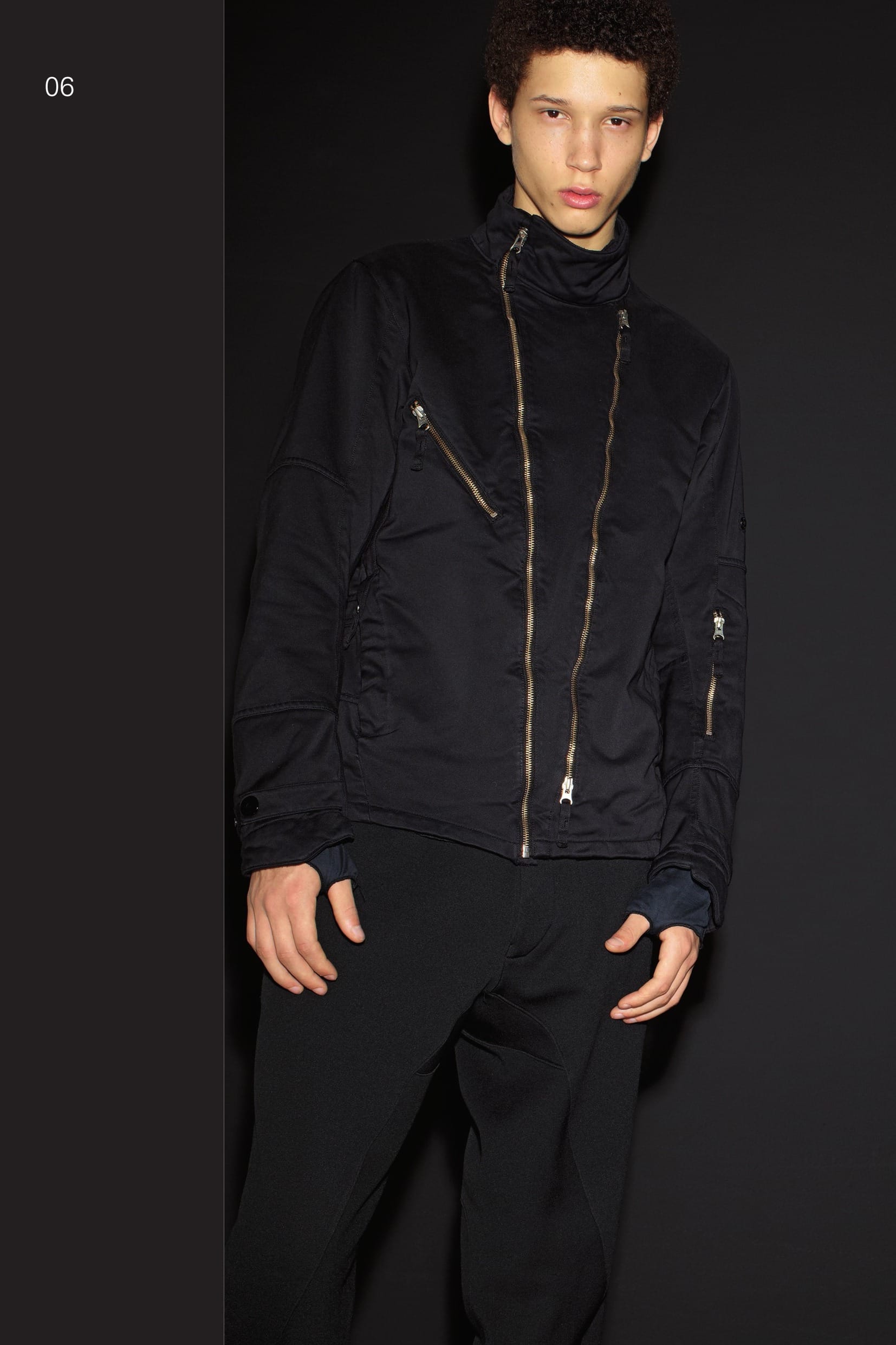 40307 CATEGORY_RESIST_CYCLONE JACKET_DAVID-T Bomber jacket in slightly stretch twill textured DAVID_T. Beginning with a Japanese polyester / polyamide substrate, garments in DAVID-T are sewn and then simultaneously garment dyed and treated with Teflon® Fabric Protector. During the dye process, the fabric undergoes heat-induced compression, radically transforming its hand and body. The results are beautiful and wearable garments with a truly unique tactile experience; both industrial and luxurious at once. _ Unique tactility _ Water and stain repellency for ideal wearability _ Stone Island garment dyed Two diagonal pockets with hidden pull-up zip fastening. One diagonal chest pocket with pull-up zip fastening. Raised collar. Diagonal zip fastening and symmetrical opening with zip fastening right along the front, hiding a multi-pocket system and the STONE ISLAND badge. Shaped sleeves, the left with a small zip-fastening pocket. Shaped cuffs with snap adjustable strap. Gussets on shoulders and horizontal insert on back waist. Quilted lining. 30309 CATEGORY_SKIN CONTOUR PANT_NYCO FELPA Joggers in double face jersey, nylon outside and cotton inside. Two diagonal front pockets with pull-up zip fastening. Slightly diagonal back pocket with zip fastening. Panel construction on the legs. Drawstrings on bottom hems. Finely ribbed nylon jersey band with internal elastic band and drawstring at the waist. Flap with hidden button fly on the front. Garment dyed.