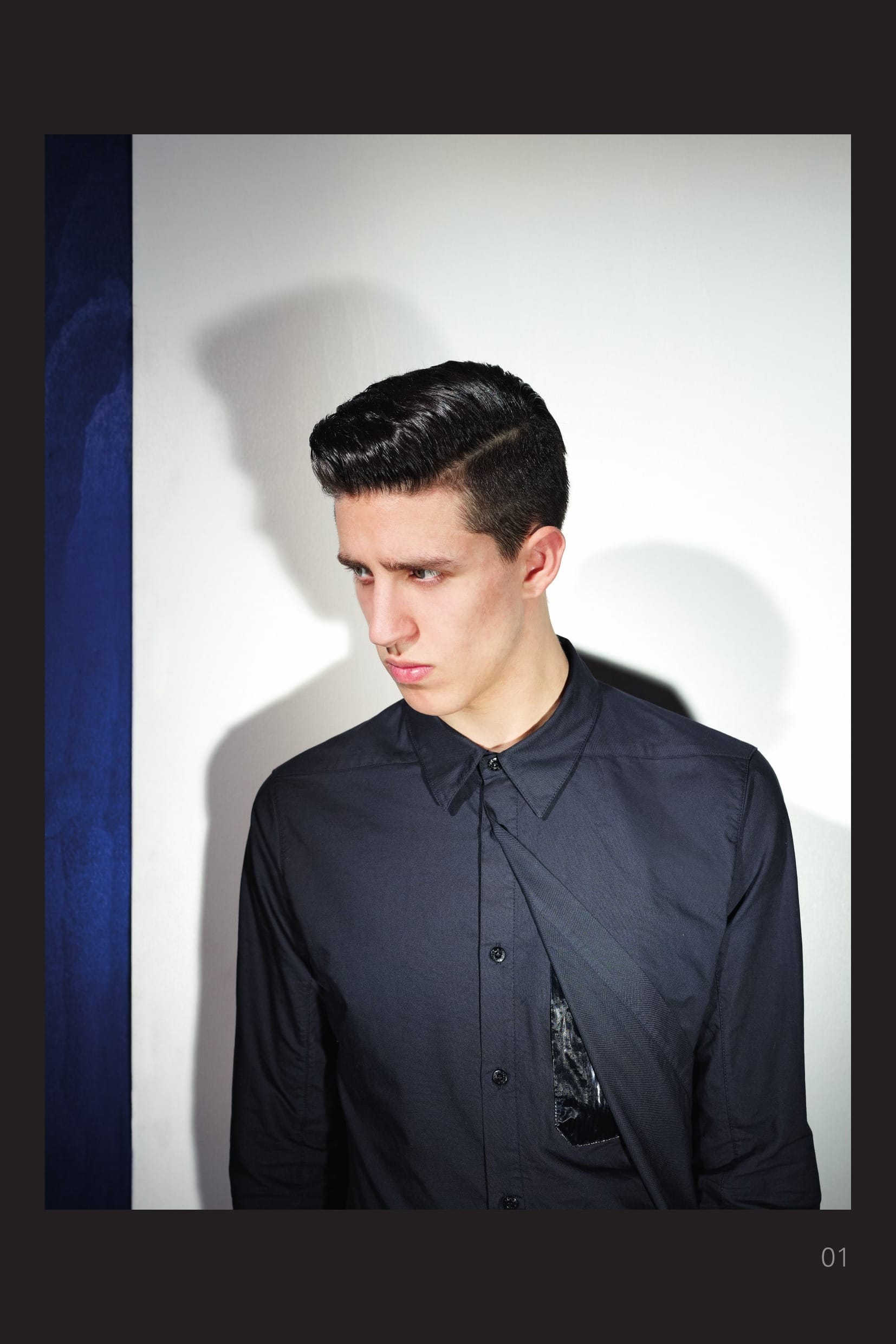 10110 CATEGORY_ SKIN _ DOUBLE PANEL SHIRT_ CO OXFORD Cotton Oxford shirt. The left front side has a second outer layer hiding two patch packets in MUSSOLA PRISMATICA, a light cotton muslin bonded to a finely grooved polyurethane film achieving a liquid/prismatic effect. Button fastening of both inner and outer layer. Yoke on back. Adjustable buttoned cuffs with MUSSOLA PRISMATICA detail. Garment dyed.