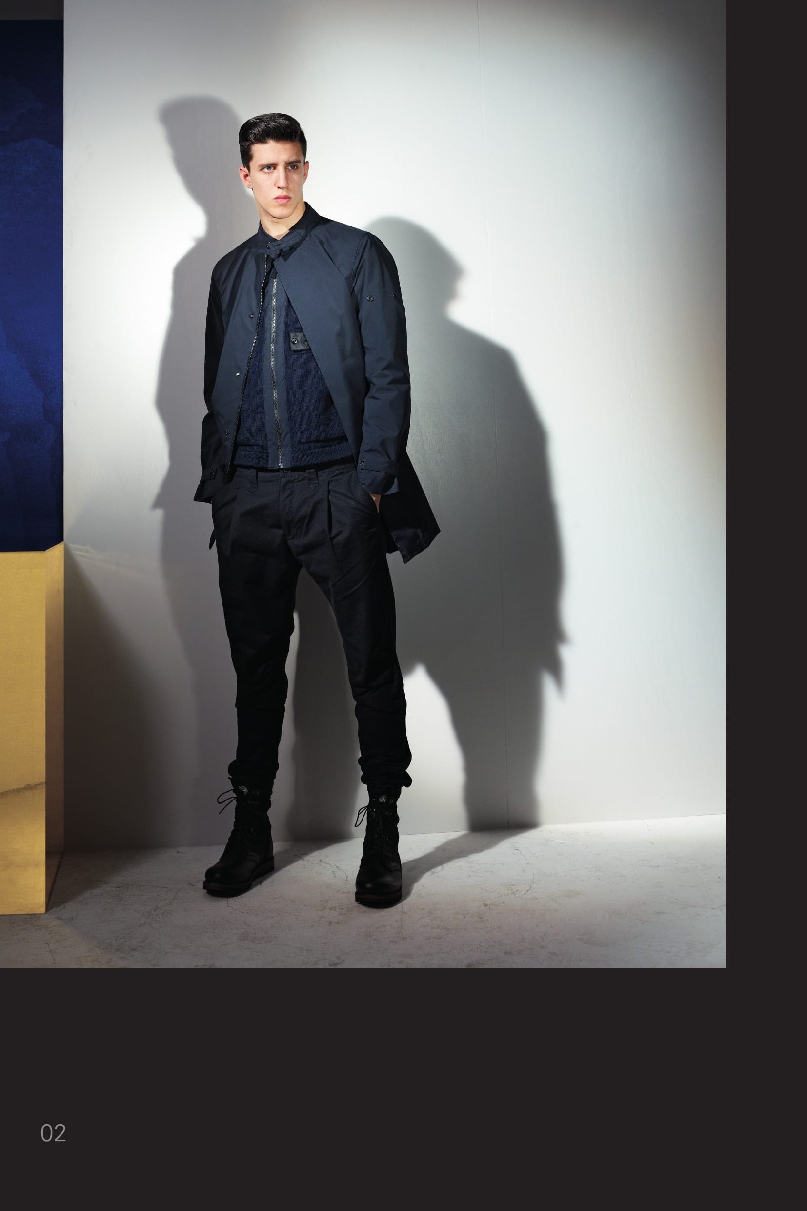 70404 CATEGORY_ PROOF_STEALTH COAT _ GORE-TEX® PROSHELL 3L WITH ENGINEERED KNIT POCKET ARRAY A hero of STONE ISLAND SHADOW ever since the very first season, the Stealth Coat, made in the Gore- Tex® Pro Shell 3L evolves by showcasing introducing a inner knitted layer. The culmination of decades of development, Gore-Tex Pro Shell® is the non-plus ultra of protective fabrics. Conceived to endure the harshest of mountain conditions, Pro Shell fabrics are an amazing fusion of the seemingly mutually exclusive properties of toughness and lightness. The revolutionary Gore® Micro Grid Backer takes perfor- mance to the next level by reducing weight and bulk, and increasing abrasion resistance. Gore-Seam® Tape and GQS (Gore Quality Standard) performance tests ensure total weather protection. _ Total waterproofness: Gore-Seam® tape and waterproof construction _ Extremely tough, extremely breathable, durably waterproof and windproof _ Engineered for extended and extreme conditions _ Guaranteed to Keep You Dry® The front of the garment is designed with two layers. Outer layer: Two vertical pockets with hidden zip fas- tening. Nehru collar with button adjustable chinstrap. Detachable hood with visor, horizontal drawstring, wind flap for neck protection and two ‘scarf’ exten- sions. Shaped cuffs with adjustable buttoned bands. Air vent under the sleeves. Vent on the back. Hidden zip and snaps fastening. Inner layer: Knitted vest in winter cotton. 4 diagonal pockets knitted ‘in macchina’, a seamless weaving construction with the body of the knit. Zip fastening. 30512 CATEGORY_ RESIST_ PLEATED PANT _ NYCO MOLESKIN Cotton nylon moleskin trousers. One pleat on front. Slanting front pockets. Slightly slanting back pockets with buttoned flap. From the knee down, panel leg construction with a back inlay in a finely ribbed cotton jersey. Crop inlay. Zip and button fly fastening. Garment dyed.