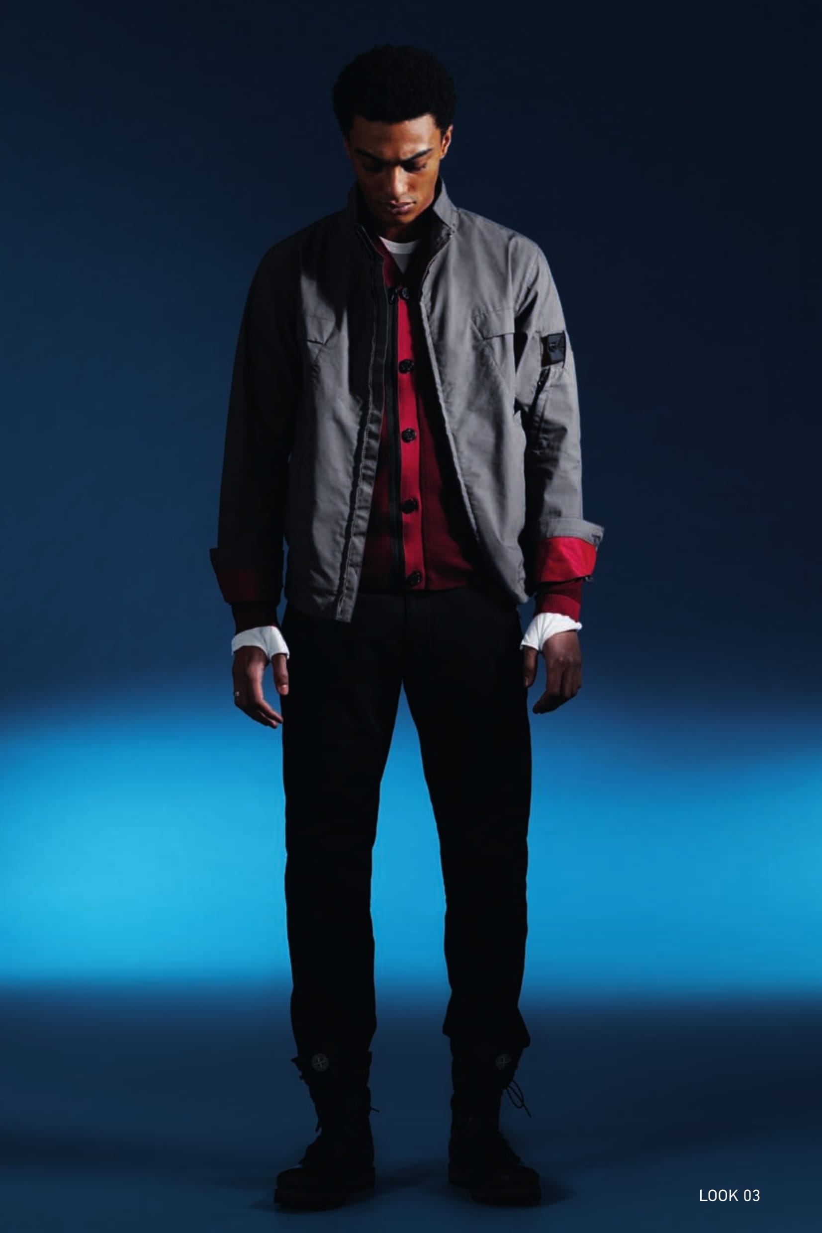 40201 HARRINGTON_CYON-R 3L Harrington jacket in CYON-R 3L, an exclusive triple-layered performance fabric. The outer face is in high density cotton poplin laminated with an internal performance, water and wind resistant, breathable membrane and an internal protective layer in nylon jersey. The Stone Island double garment dyeing process bestows the garments in CYON-R 3L with vibrant multi-dimensional colours and, if required, strong contrasting colours. Raised collar. Front yoke with seams joining it to the diagonal pockets with the exclusive ‘Tuck-in’ construction of the pocket closure, housed under the flap. Air vent under the armhole. Zip-fastening pocket on one sleeve: the pocket partially covers the Stone Island Shadow Project badge. Back yoke. Button fastening cuffs. Metal zip fastening. 503A1 ZIP CARDIGAN_WO/PL/PA JACQUARD State of the Art in knitwear construction. V-neck cardigan in a blend of wool, polyester and polyamide yarns seamlessly woven with a combination of jacquard and placed intarsia techniques. Seamless pocket construction. Slightly off-centre black zip fastening and buttons mounted on a machine knitted border. 20314 LS UNDERSHIRT_JERSEY MAKO’ Long-sleeve T-shirt in Mako cotton interlock. Garment dyed. Double-needle stitching. Ergonomic sleeves with integrated fingerless gloves. Ribbed neck. Side stitching shifted towards the front. Central stitching on the back. 30611CHINO_CO STRUCTURED Chinos in micro textured comfort cotton. Two diagonal side pockets. Two back pockets with flap and partially concealed button fastening. Reinforced crotch. Zip fly and semi-concealed button at the waist.