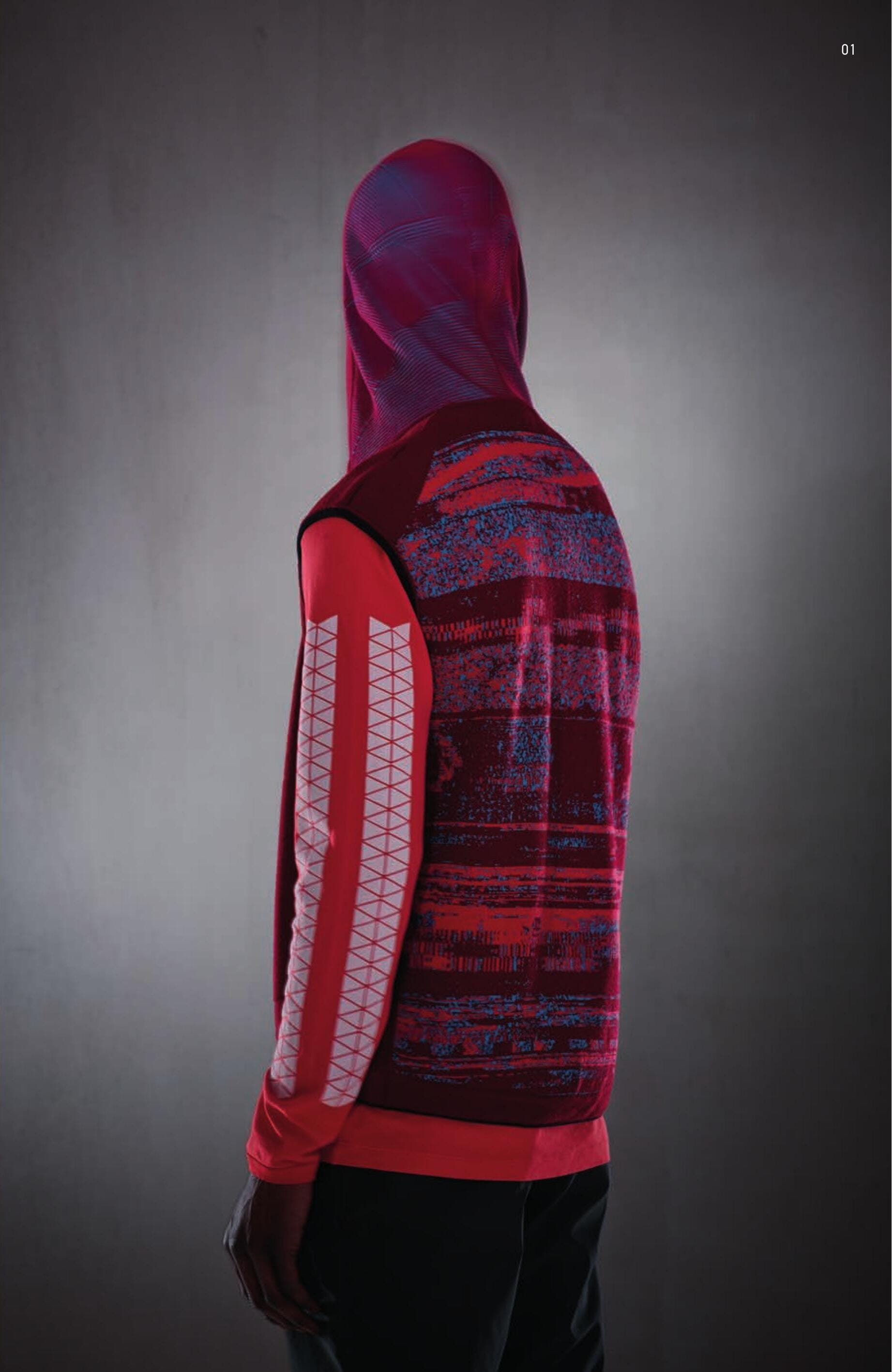 505A6 CONTOUR VEST _ WO/PL/PA State of the Art in knitting techniques. Hooded vest knit in wool/ polyester/nylon, made by combining several weaving techniques as well as jacquard techniques and seamless placed inlays. Plain wool front with seamless construction of the pouch pockets. Ribbed motive on sides. Hood shaped through seamless techniques, with changing colours appearences of the ribbed construction for a three dimensional effect. On the back, a jacquard weaved motive using different yarns creates a ‘glitch’ effect, the ’disturbed’ graphical effect on monitors because of system interferences. Armholes and bottom edged in a ribbed solid colour nylon yarn. Zip fastening. 20213 LS T-SHIRT PRINTED _ INTERLOCK MAKO CO Long sleeve T-Shirt in mako cotton interlock. Small chest print. Print on sleeves. Big print on back carrying the CXADO 6119 motive. Garment dyed. 30105 HIGH WAISTED CHINO _ DIAGONAL PL Chino trousers in shiny diagonal weave polyester. Slightly high waist cut. Vertical opening pockets parallel to the dart. Horizontal opening back pockets, inserted into the yoke. Zip fastening. Garment dyed under pressure at 130°C.