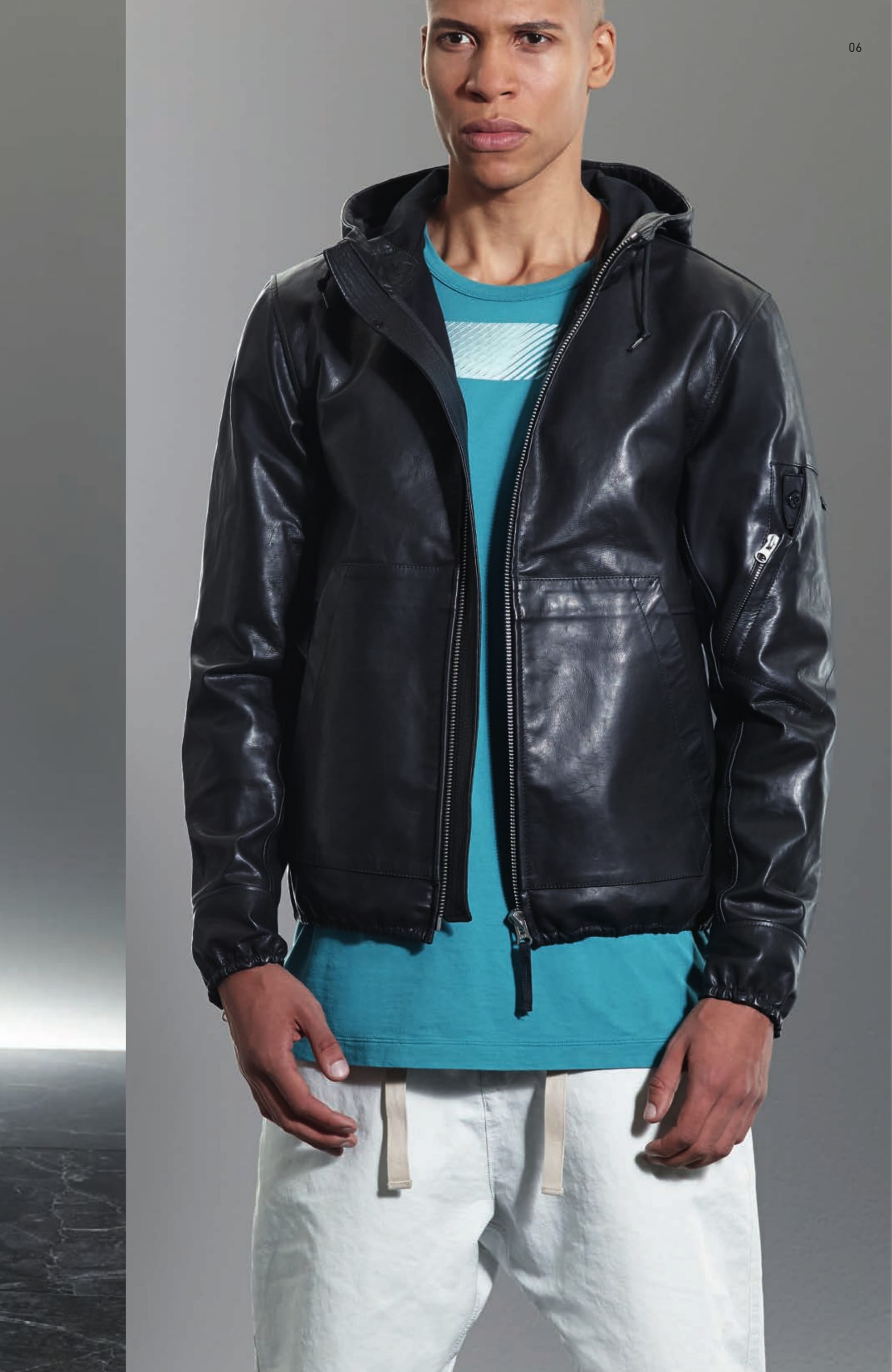 00121 HOODED JACKET _ BONDED LEATHER Hooded jacket in leather bonded inside to cotton jersey. Drawstring on hood. Patch front pockets with diagonal opening. Elasticated cuffs with zip opening. Air vent under armholes. Shoulder yoke. Elasticated bottom line. Zip and one snap fastening. 20111 SS T-SHIRT PRINTED _ INTERLOCK MAKO CO Short sleeve T-Shirt in Mako cotton interlock. Garment dyed. Wide and long fit. Ribbed neckline. Trapeze shaped ‘Catch pocket’ on chest, with side opening. Print on chest. Big 6219 CXADO print on back. 30203 WIDE PANT _ DAVID-C Pants in David-C. Garment dyed under pressure. Over-dyed cotton recipe. This historical Japanese star shaped cross section polyester/polyamide microfiber, is enriched by an inner diagonal cotton face coming directly from the loom. The high pressure 130°C garment dyeing procedure colours the polyester outer surface and transforms the hand of the material resulting in a unique tactile experience. After thoroughly washing the piece, a second dye bath over-dyes the inner cotton surface. This double dye procedure enables a wide range of tone on tone or highly contrasting colours. Wide fit, low crotch. Diagonal front pockets. Two back pockets with button fastening. Vertical fitting seam above back pockets. Leg bottom edge with tape edging. Drawstring at waist. Zip and button fastened fly.