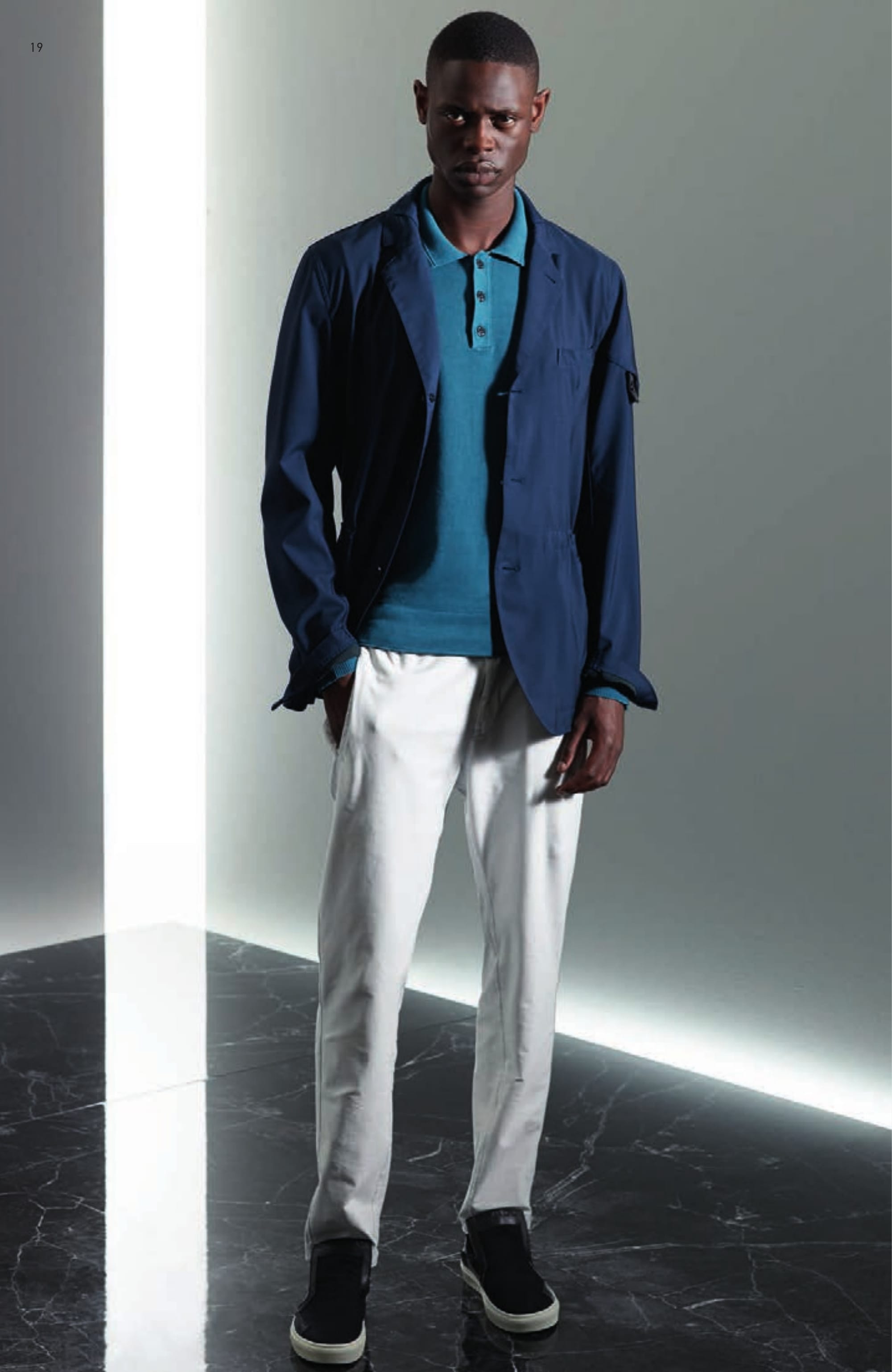 A0405 SB DRAWCORD BLAZER _ COATED WOOL Single breasted hybrid blazer in light wool gabardine, lightly pigment coated on the inside to give body to the fabric and achieve a two-colour effect. Collar with overstitched panel in the same fabric. Notched lapels with squared indents. Vertical fitting seams on front. Slanting front pocket. Chest pocket. Drawcord at waist. On the left sleeve, partly concealed Stone Island Shadow Project badge. Concealed buttons at cuffs. Three buttons fastening. 502A3 POLO _ CO PIGMENT DYE Long sleeve Polo shirt knit in light cotton crêpe. Garment dyed and subsequently over-dyed with natural pigments to achieve a deep and iridescent colour shade. Ribbed collar with two parallel raised lines and three buttons fastening. Zigzag motif on the ribbed cuffs. Ribbed inner bottom line. On the left sleeve, partly concealed Stone Island Shadow Project badge. 30312 CHINO _ 4 WAY STRETCH Chino/track pants in 4 ways stretch smooth heavy nylon. Garment dyed. Wide fit. One small pleat along vertical front pockets. Two back pocket. Seat inlay. Elasticated waist with drawstring. Zip and buttoned fastened fly. S0122 STEP-ON SLIP-ON 3 _ CANVAS / LEATHER / PONY HAIR Modular and versatile shoe. The back of the shoe, in heavy ribbed double layer nylon jersey transforms this deck-shoe into a slip-on shoe. Cotton canvas upper with leather and pony hair inlays. Oversized tongue carrying the CXADO heat print motif. White real rubber sole.
