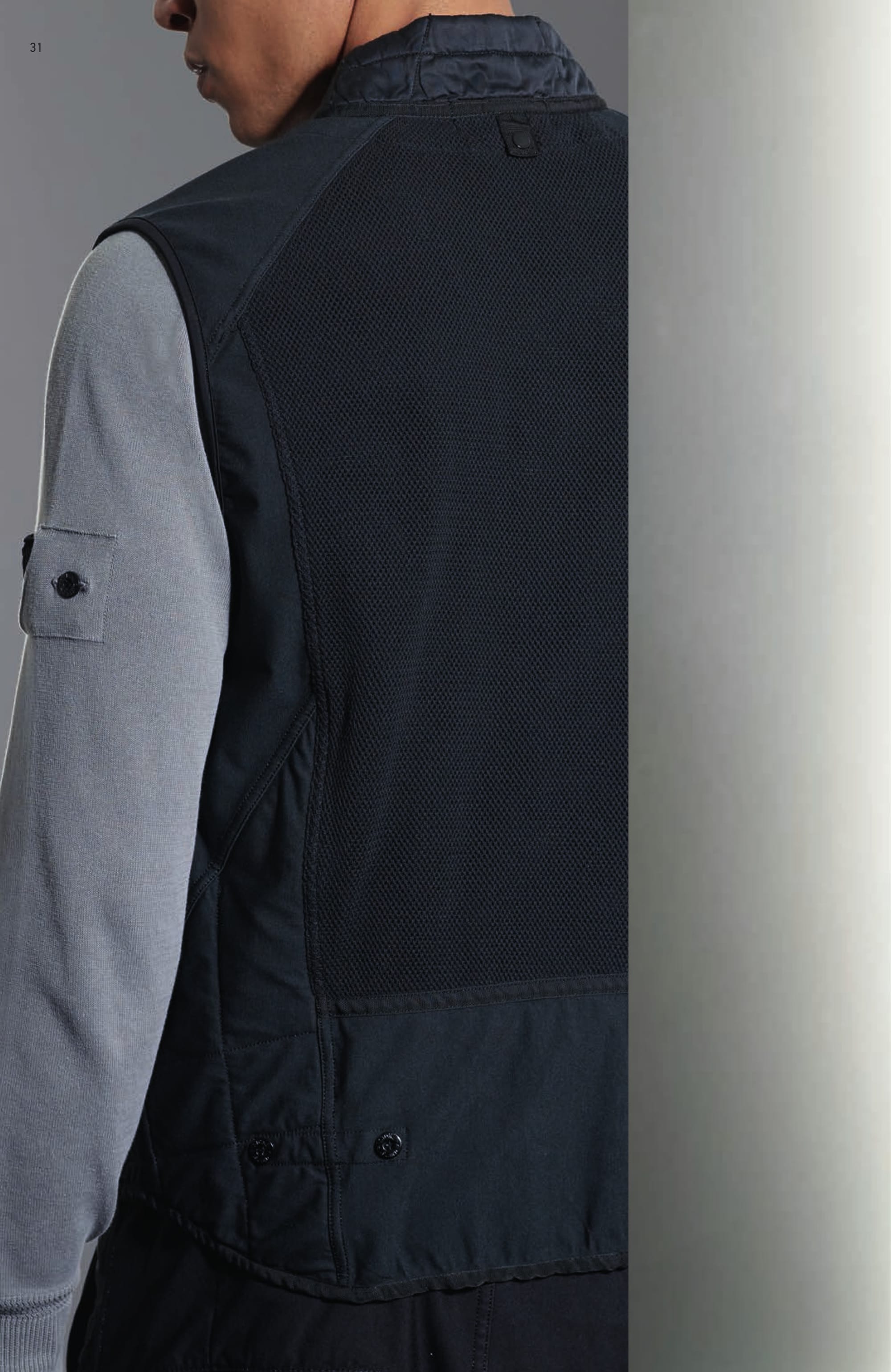 G0112 MODULAR VEST _ 4-WAY STRETCH Vest in 4 ways stretch smooth heavy nylon. Garment dyed. Modular item engineered to augment the insulation properties of the outerwear pieces: it can be fixed, through loops and snaps, to all the Stone Island Shadow Project shoulder pieces. Round neckline with quilted and padded collar stand on the rear. Cotton mesh patch pockets with diagonal opening. Cotton mesh double layer inlay on the back. Lightly padded and quilted inlay on bottom sides. Zip and two snaps fastening. 501A3 V NECK _ CO PIGMENT DYE Long sleeve V-neck knit in light cotton crêpe. Garment dyed and subsequently over-dyed with natural pigments to achieve a deep and iridescent colour shade. Ribbed collar. Zigzag motif on the ribbed cuffs. Ribbed inner bottom line. On the left sleeve, partly concealed Stone Island Shadow Project badge.