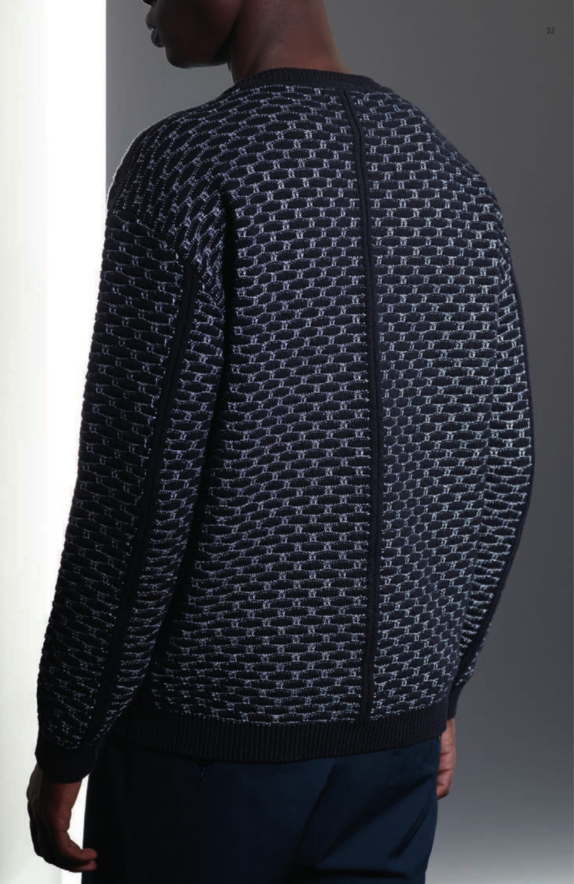 504A1 WIDE CREW NECK _ CO/PL INTARSIA Crew neck knit in cotton and polyester yarns with an intarsia technique construction. Wide fit. Raised cotton motif on silver polyester. Ribbed neckline, cuffs and bottom band. Vertical raised cotton profiles on sides, sleeves and central back. 30312 CHINO _ 4 WAY STRETCH Chino/track pants in 4 ways stretch smooth heavy nylon. Garment dyed. Wide fit. One small pleat along vertical front pockets. Two back pocket. Seat inlay. Elasticated waist with drawstring. Zip and buttoned fastened fly.