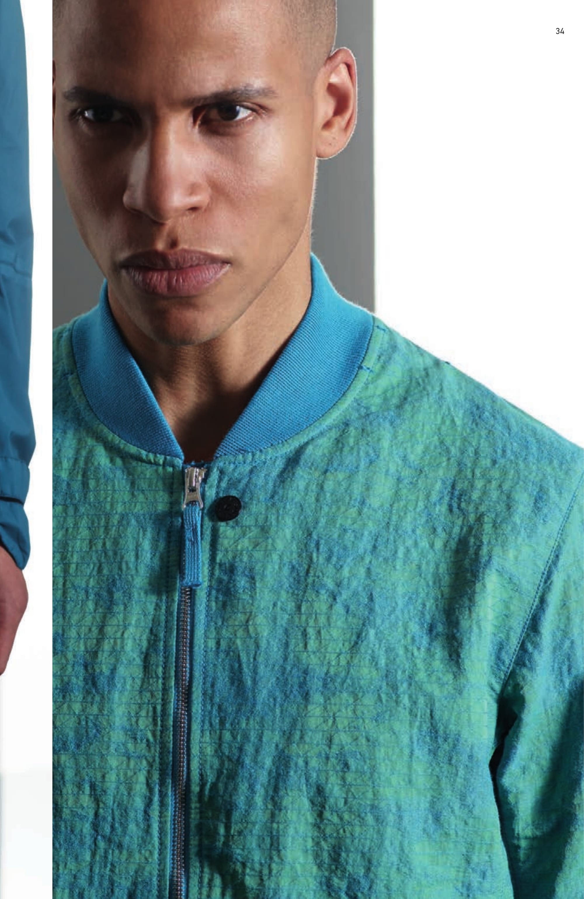 40304 BOMBER JACKET _ DPM GRID JACQUARD Bomber Jacket in custom made Stone Island DPM design cotton/nylon jacquard. Garment dyed with double dye recipe. It is fitting that industrial age Jacquard looms are regarded by many as a precursor to modern computer science; the resolution and complexity achievable with today’s machines are an elegant reflection of the digital age. The cotton and nylon yarns of DPM GRID JAQUARD are garment dyed separately in complementary or contrasting colours. The results of this dye procedure are spectacularly multi-layered; capturing both high definition contrasts or subtle tonal shading depending on colour combination. Computation rendered in physical wearable form. Ribbed cotton collar, cuffs and bottom band. Shaped front bellows pockets with zip fastening. Wide armholes to ease movement. Zip and two snaps fastening.