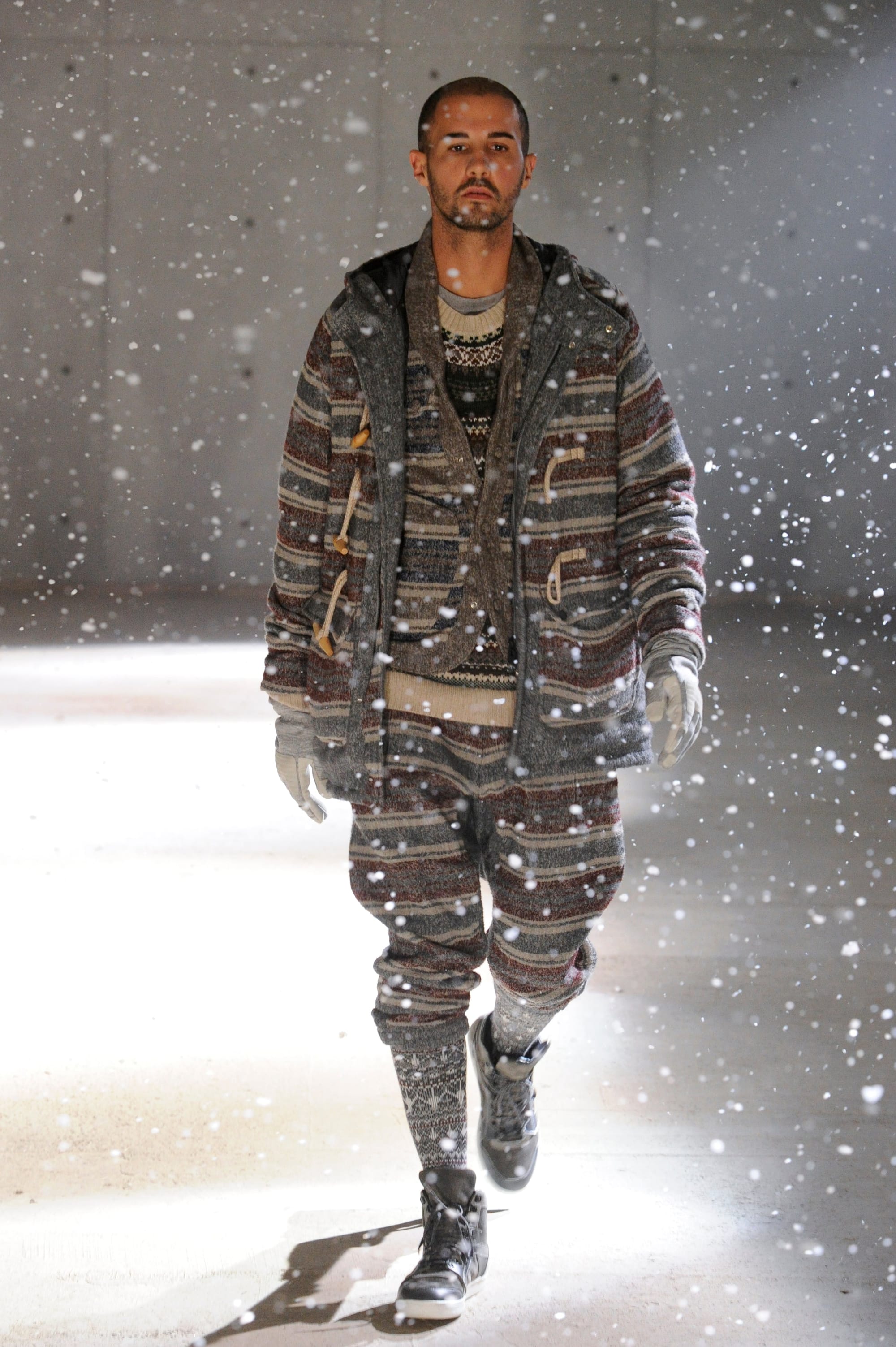 White Mountaineering Wilderness Outfitters look 12: Fair Isle hooded knit and checked trousers with red hiking boots.