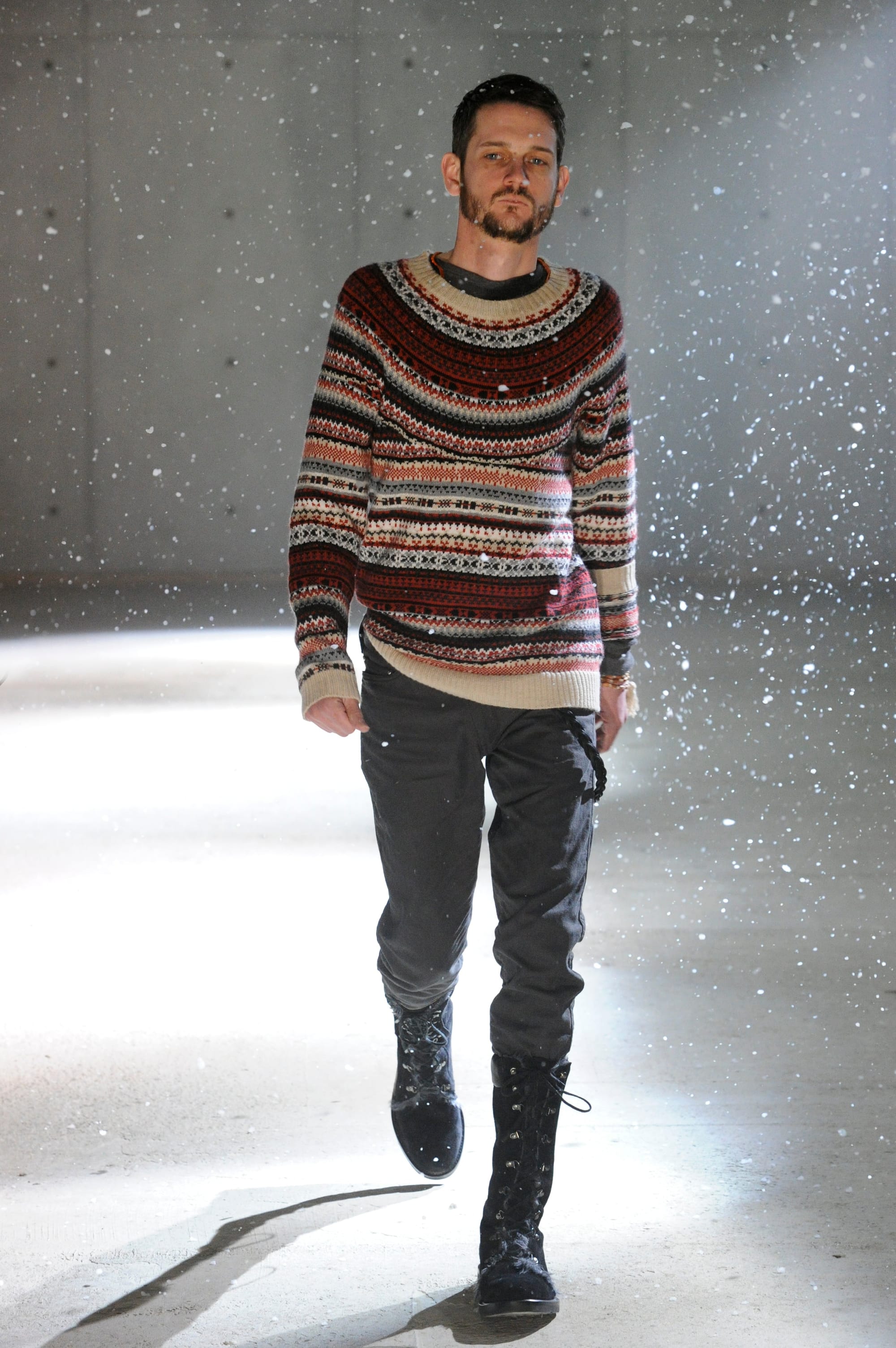 White Mountaineering Wilderness Outfitters look 15: grey layered field suit with fur scarf and red shirt cuffs.