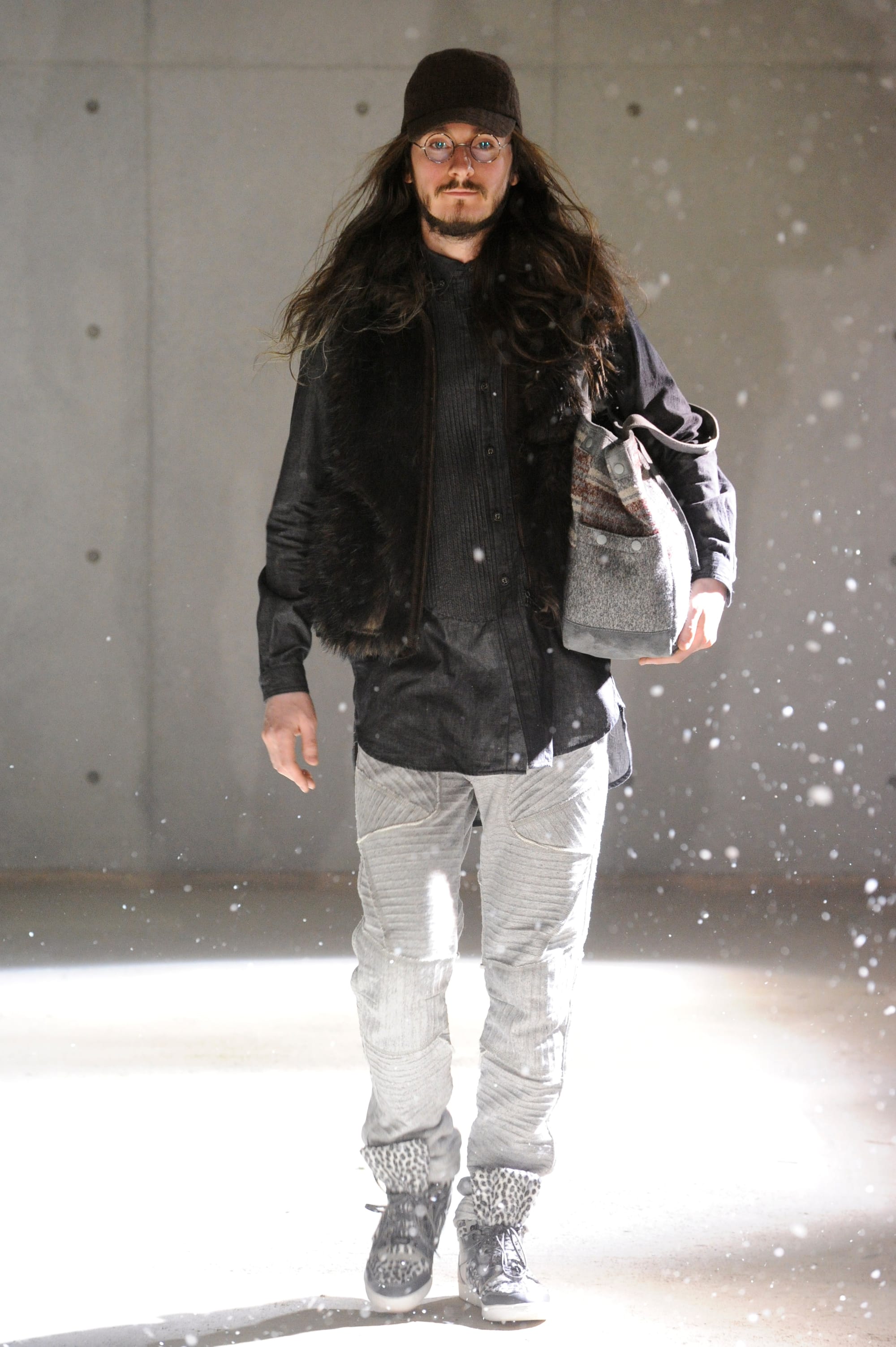 White Mountaineering Wilderness Outfitters look 17: brown field jacket, fur hat and tan cargo trousers.