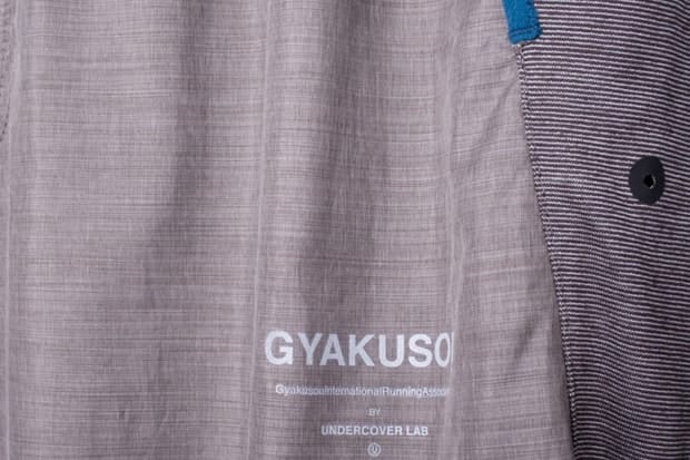 Runner seated in Gyakusou FW2011 apparel in Kyoto