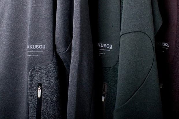 Runner in a dark Gyakusou FW2011 hooded jacket in Kyoto