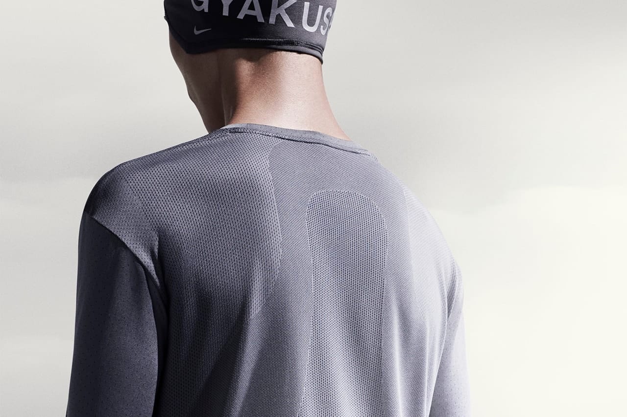 Man in gray Gyakusou Holiday 2014 technical running layers