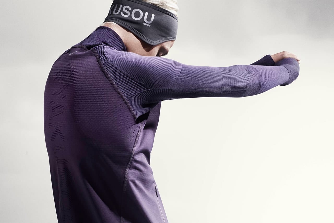 Man in black and gray Gyakusou Holiday 2014 running apparel