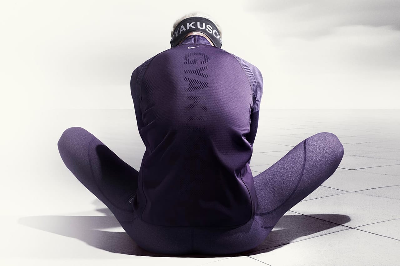 Woman in dark Gyakusou Holiday 2014 technical running layers