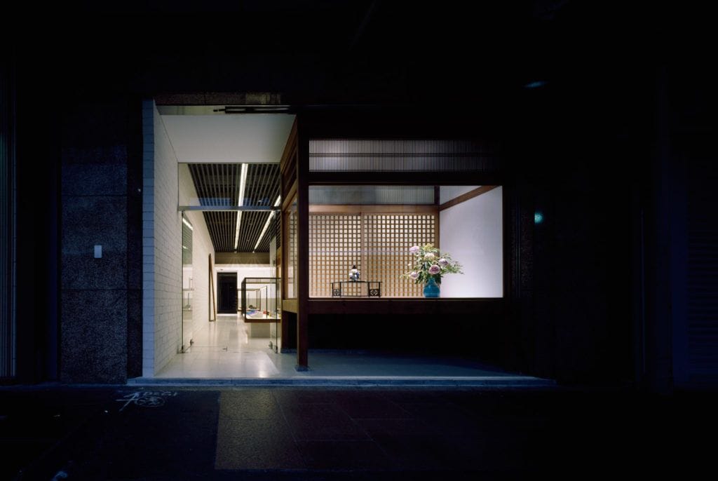 Visvim F.I.L. Kyoto storefront illuminated at night.
