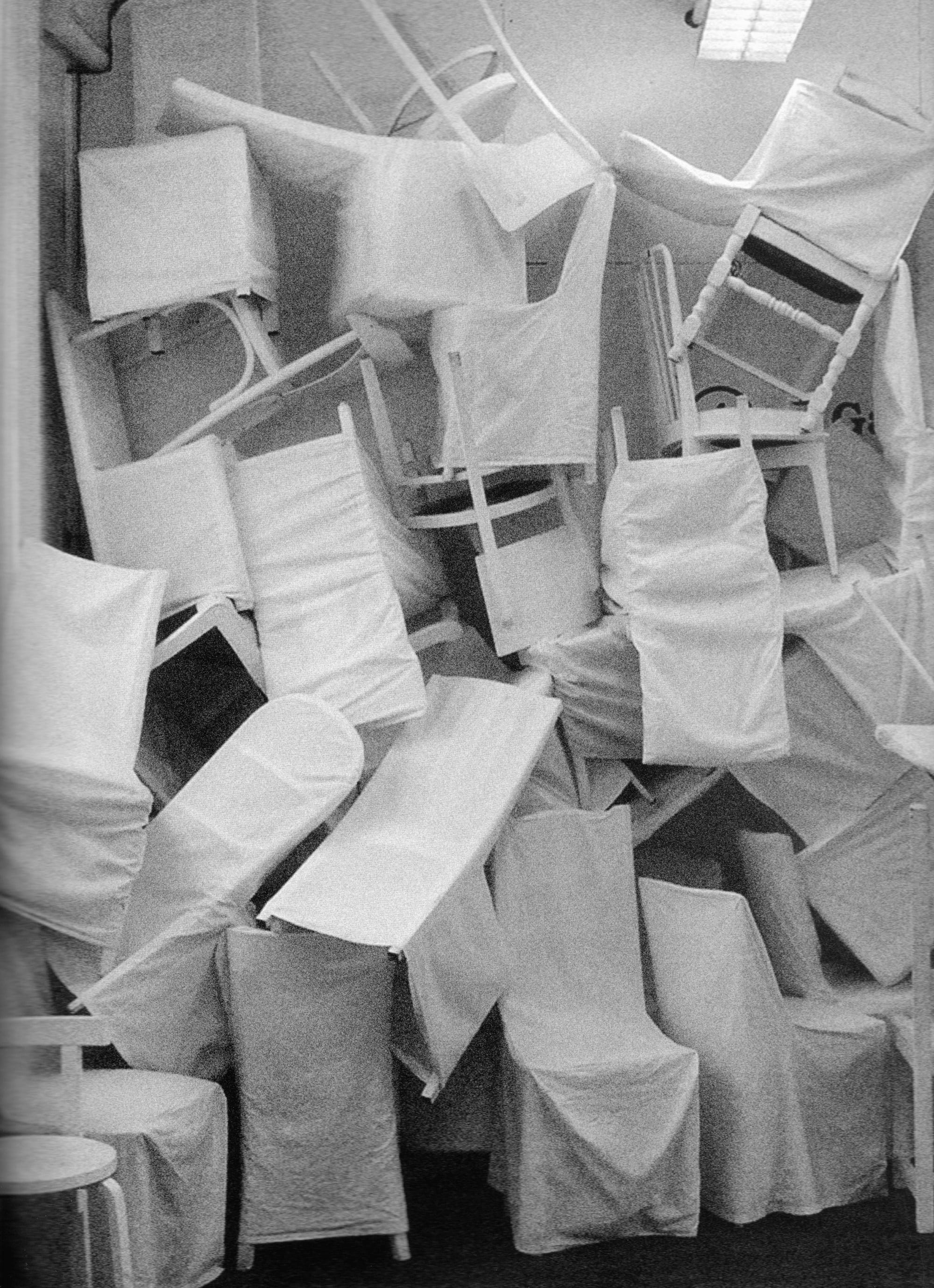 White-covered furniture installation in the Maison Martin Margiela rue Saint-Maur showroom.