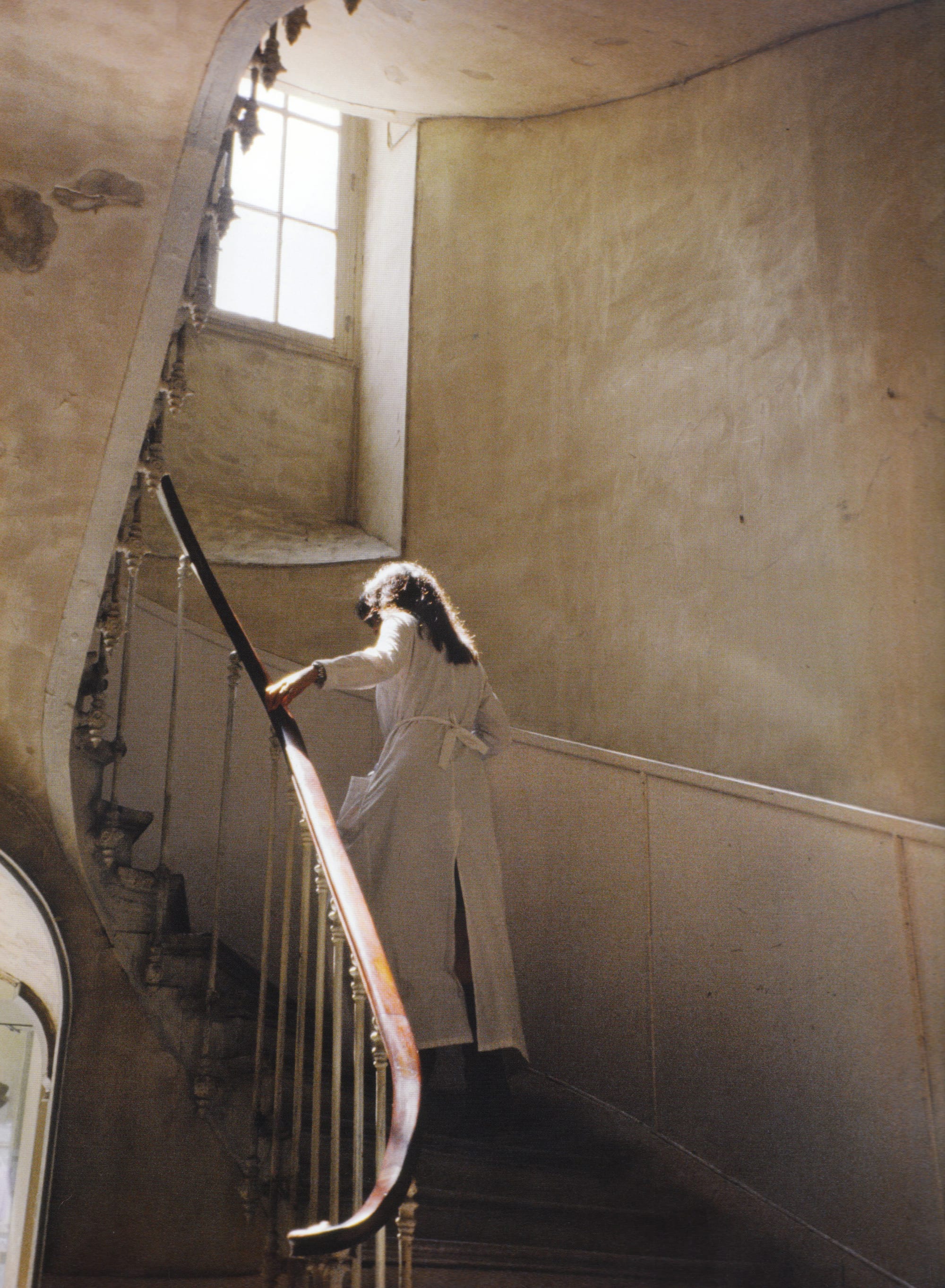 Maison Martin Margiela staff member on the stairs at the rue Saint-Maur headquarters.
