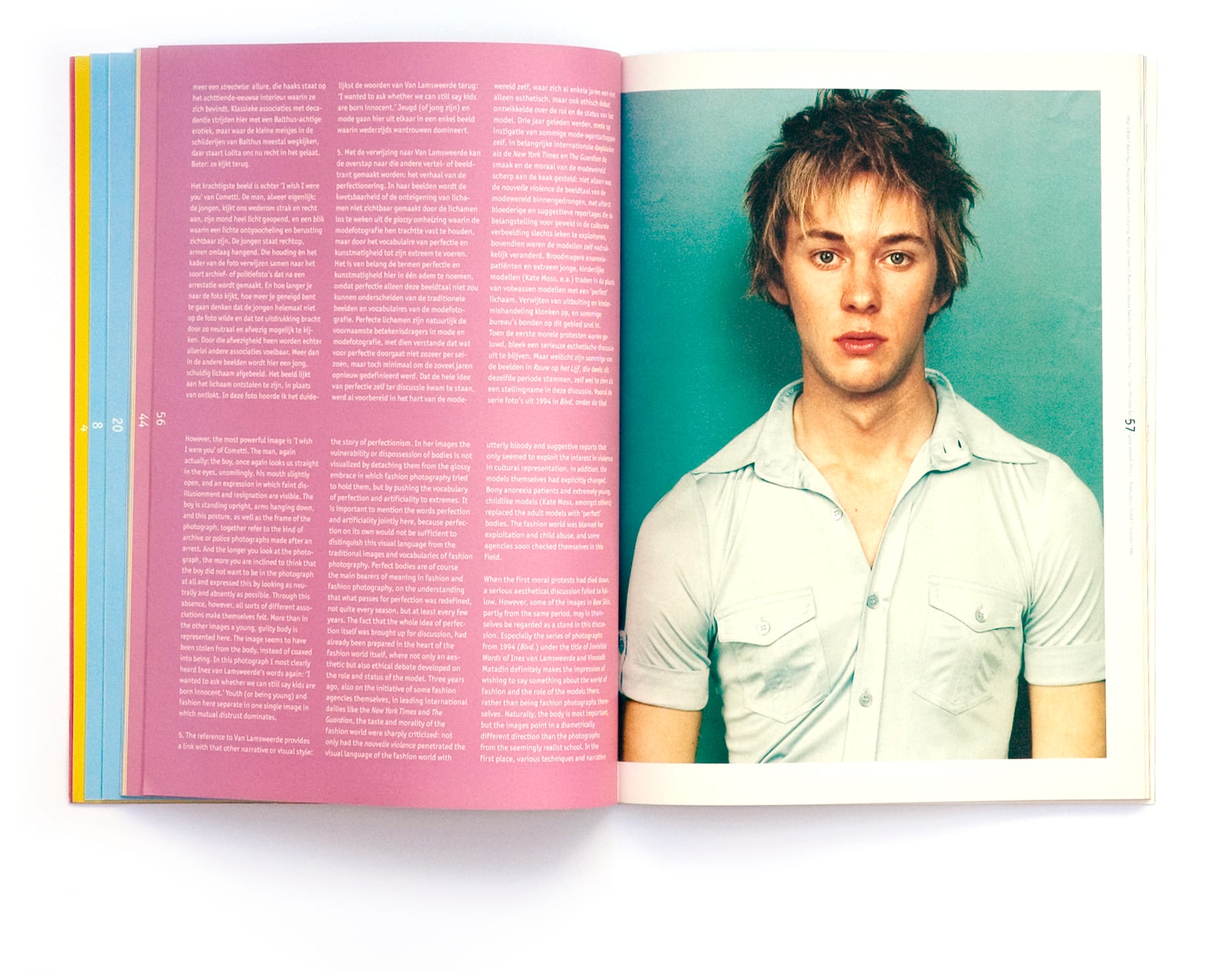 Pink bilingual essay spread with a young man photographed against a cyan background.