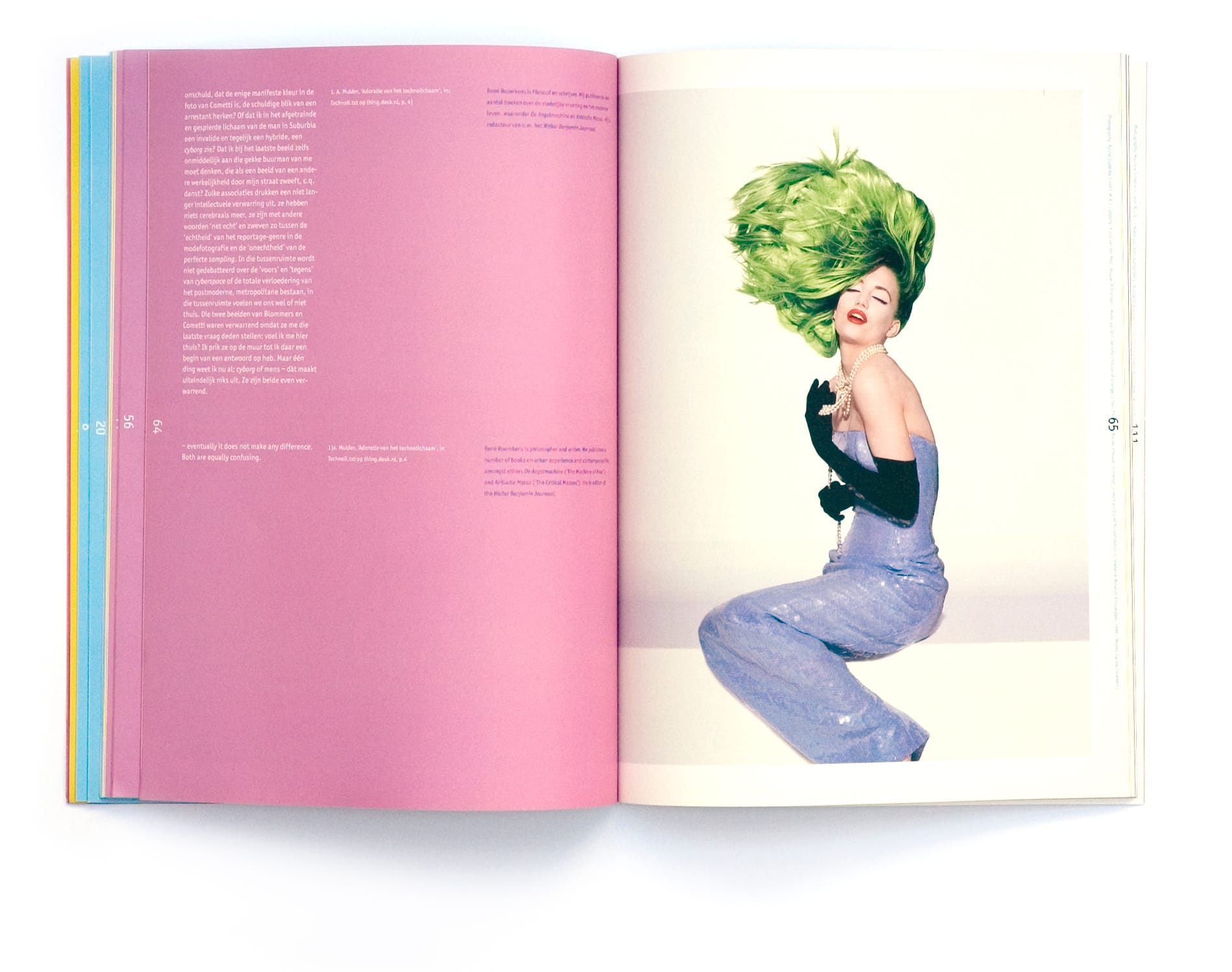 Woman in lavender with black gloves, pearls and an exaggerated green feathered hairstyle beside a pink essay page.
