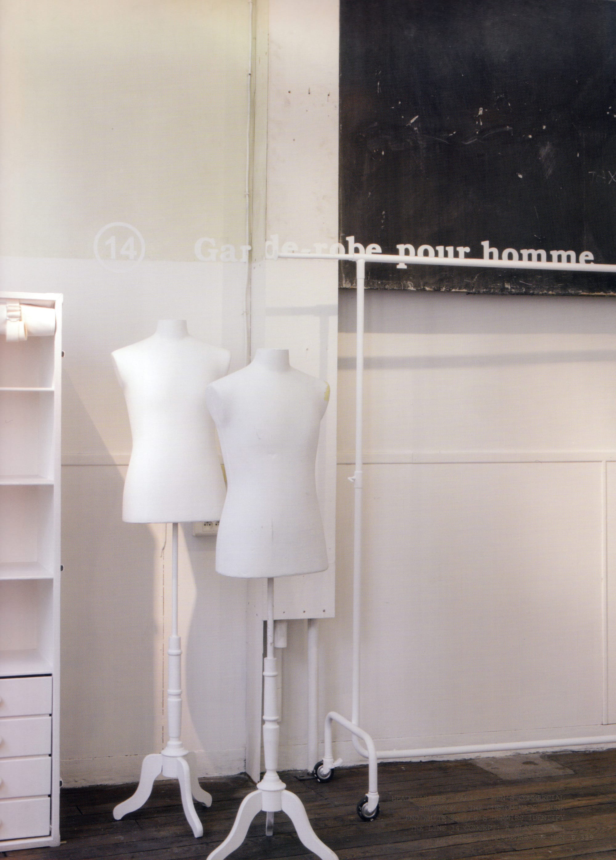 Maison Martin Margiela men's showroom with a custom trunk and white tailor's dummy.