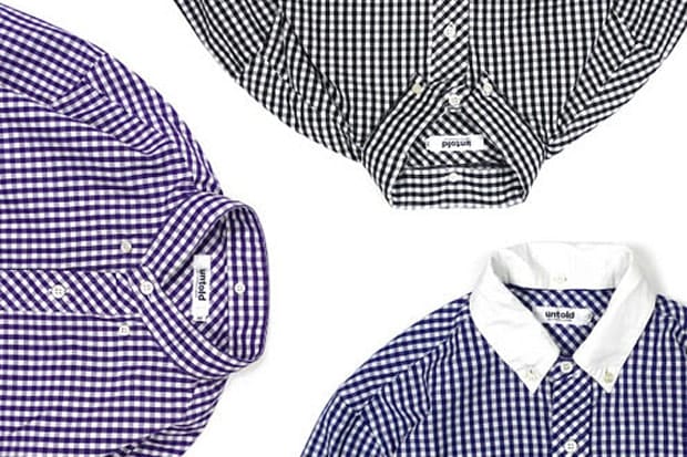 Three UNTOLD gingham button-up shirts in purple-white, black-white and blue-white checks, arranged around their collars.