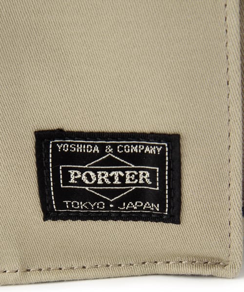 YOSHIDA & COMPANY PORTER woven label on beige fabric.