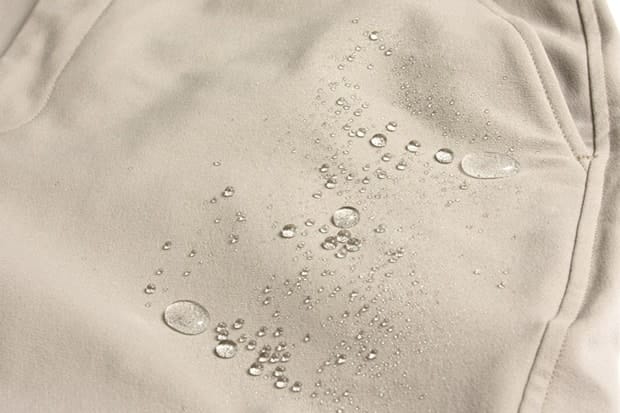 Water beads on the Schoeller Dryskin Extreme fabric of Outlier Khaki OG Pants.