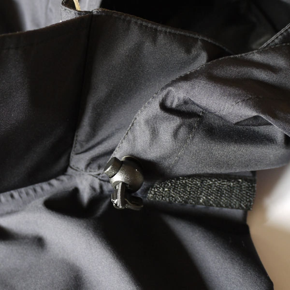Black drawcord and bonded fabric detail inside the Griffin GFT 014 Technical Bearskin jacket.