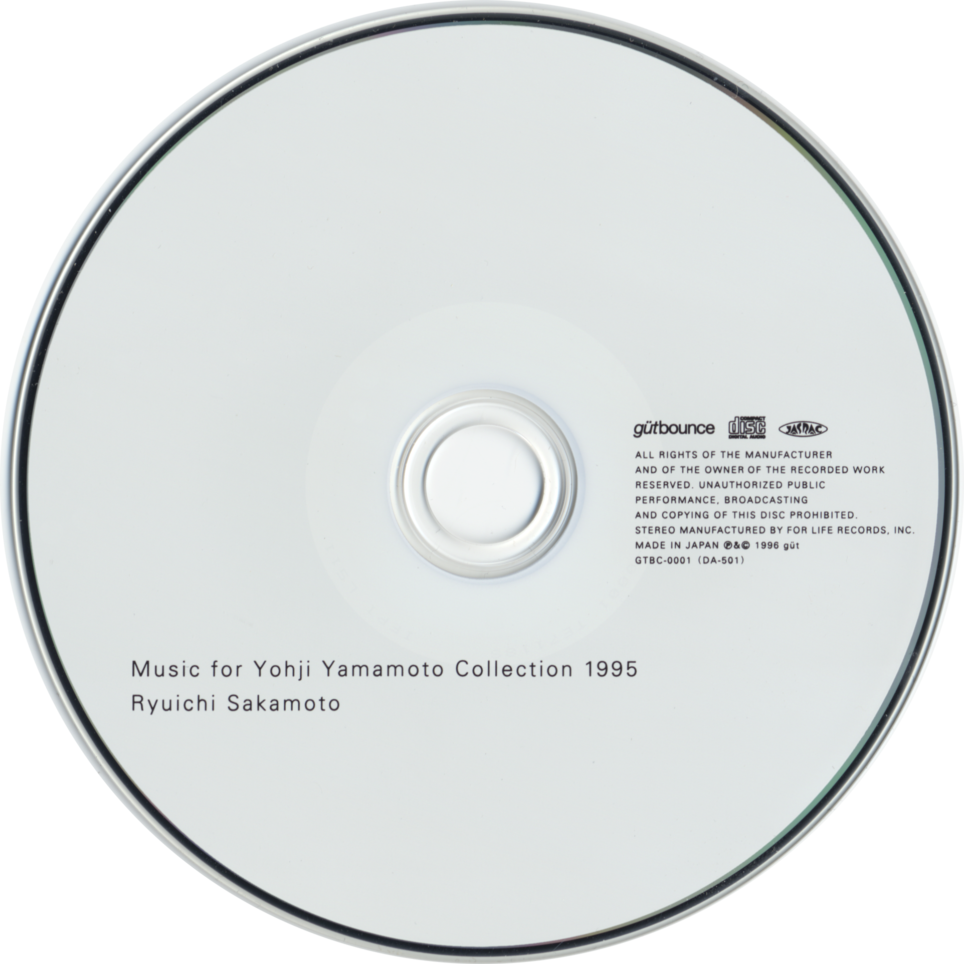 White compact disc printed with Ryuichi Sakamoto, Music for Yohji Yamamoto Collection 1995, and güt bounce GTBC-0001.