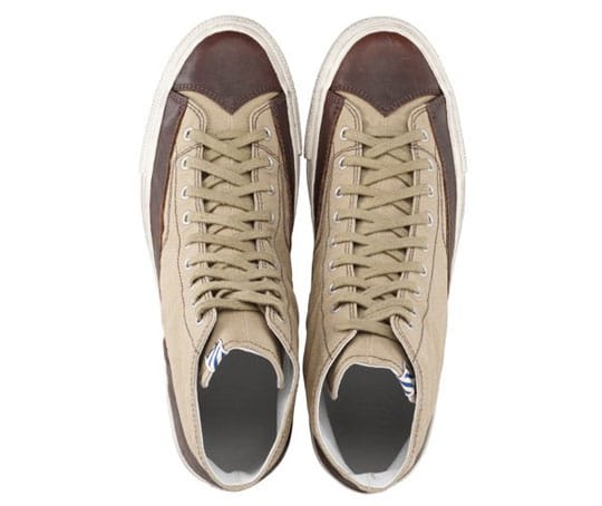 Top view of khaki canvas visvim SKAGWAY ESTLIN sneakers with brown leather toe panels.