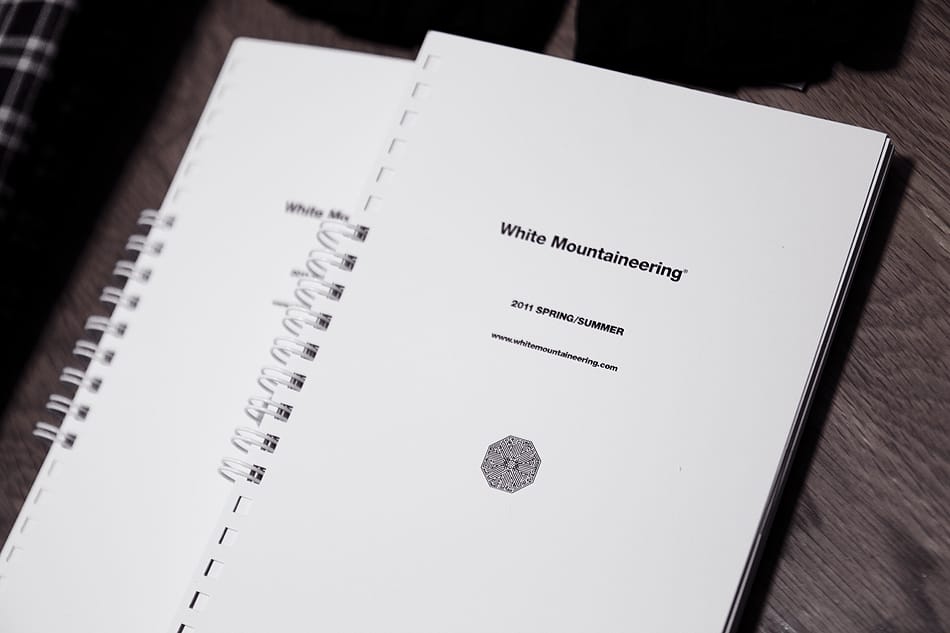 White Mountaineering 2011 Spring/Summer collection book open on a table.