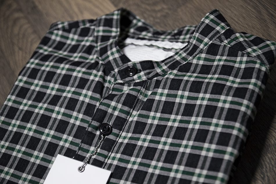 Black, grey and green plaid White Mountaineering button-up shirt from Spring/Summer 2011.